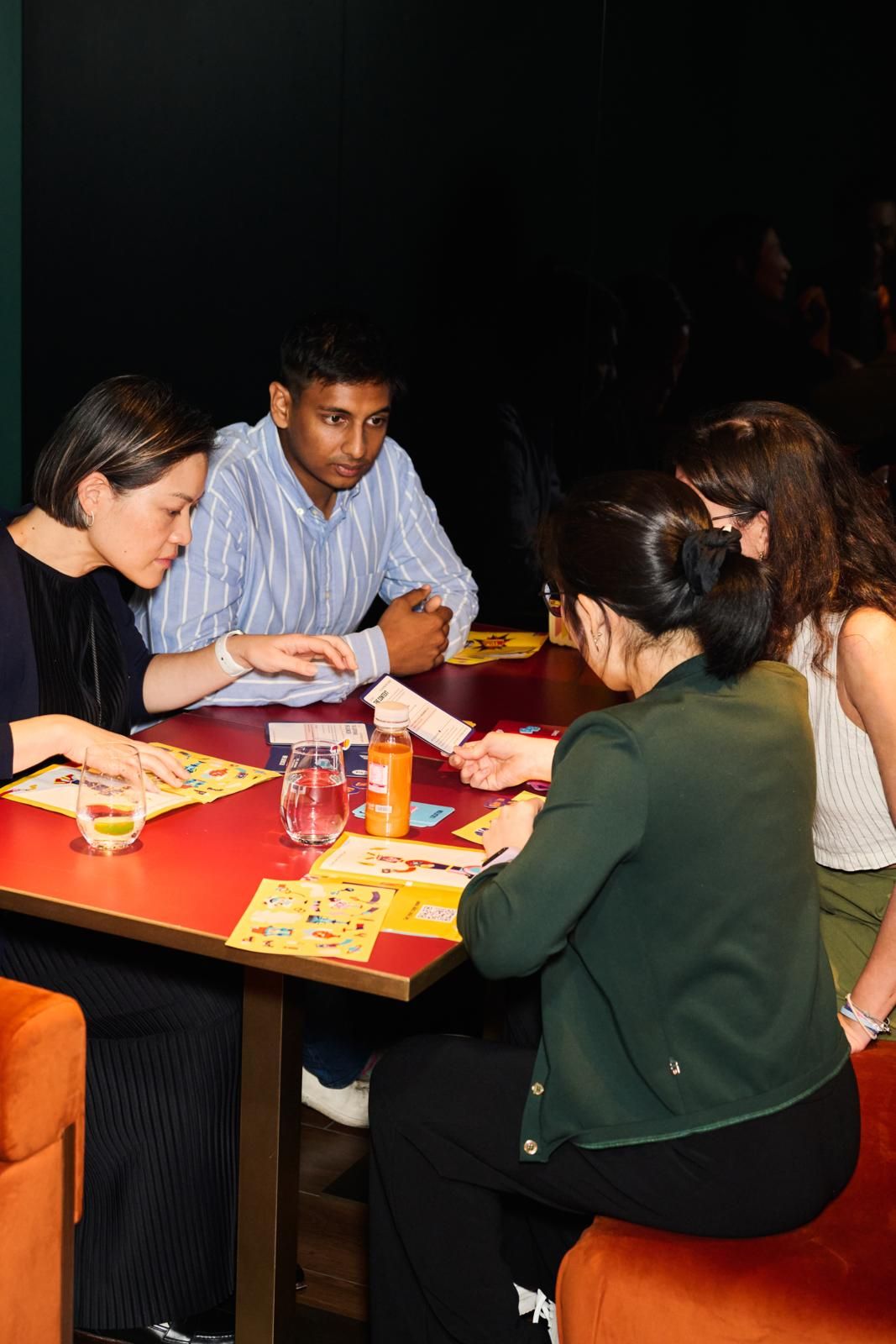 Chi Yan Chan, director of Collective, Sidhant Gupta, co-founder and CEO of Clearbot, Carla Martinesi, founder and CEO of Chomp, and Stephanie Ng, founder and executive director of Body Banter, engaged in playing the game (Photo: Zed Leets/Tatler Hong Kong)