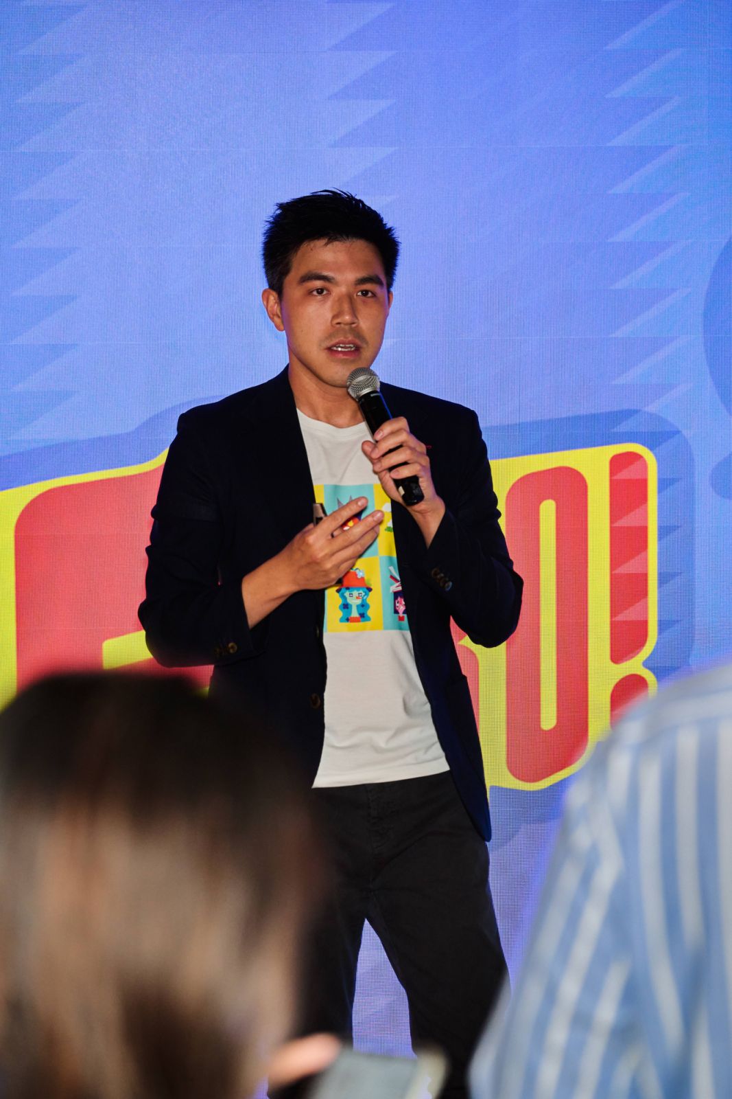 Vincent Siu, the founder and lead producer of Press Start Studios, introduces the card game Fiero! to guests at the launch event in Hong Kong (Photo: Zed Leets/Tatler Hong Kong)