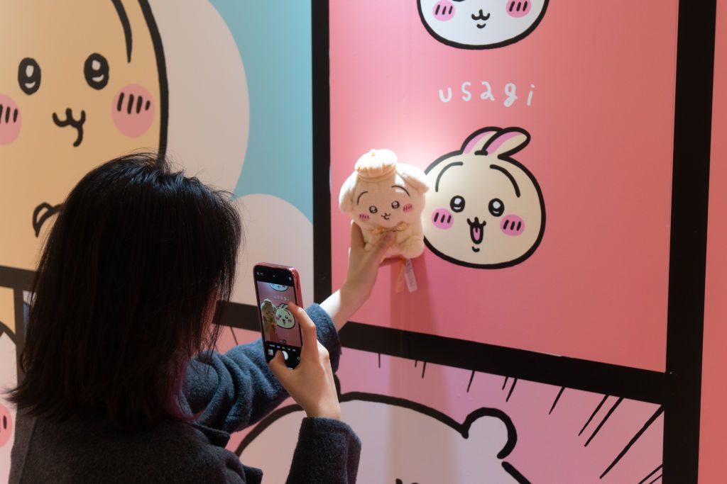 SHANGHAI, CHINA - MARCH 31, 2024 - Young people buy Chiikawa dolls of various sizes and derivatives at MINISO X Chiikawa themed pop-up shop in Shanghai, China, March 31, 2024. (Photo credit should read CFOTO/Future Publishing via Getty Images)