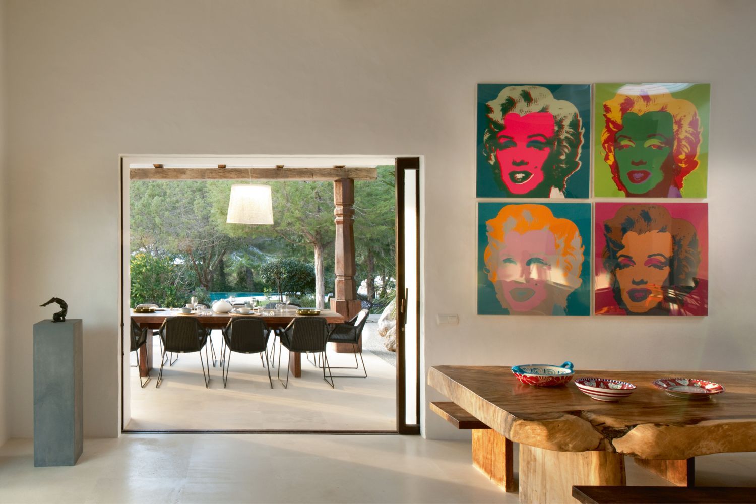 The home opens up to views of the outdoor dining area and the pool beyond (Photo: Philip Vile)