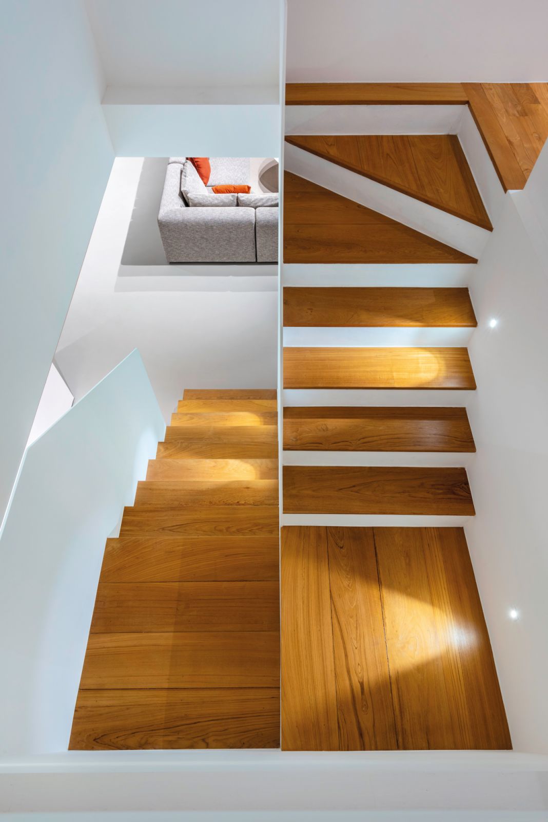 These parquet stair treads are a beautiful complement to the white-painted galvanised steel railing