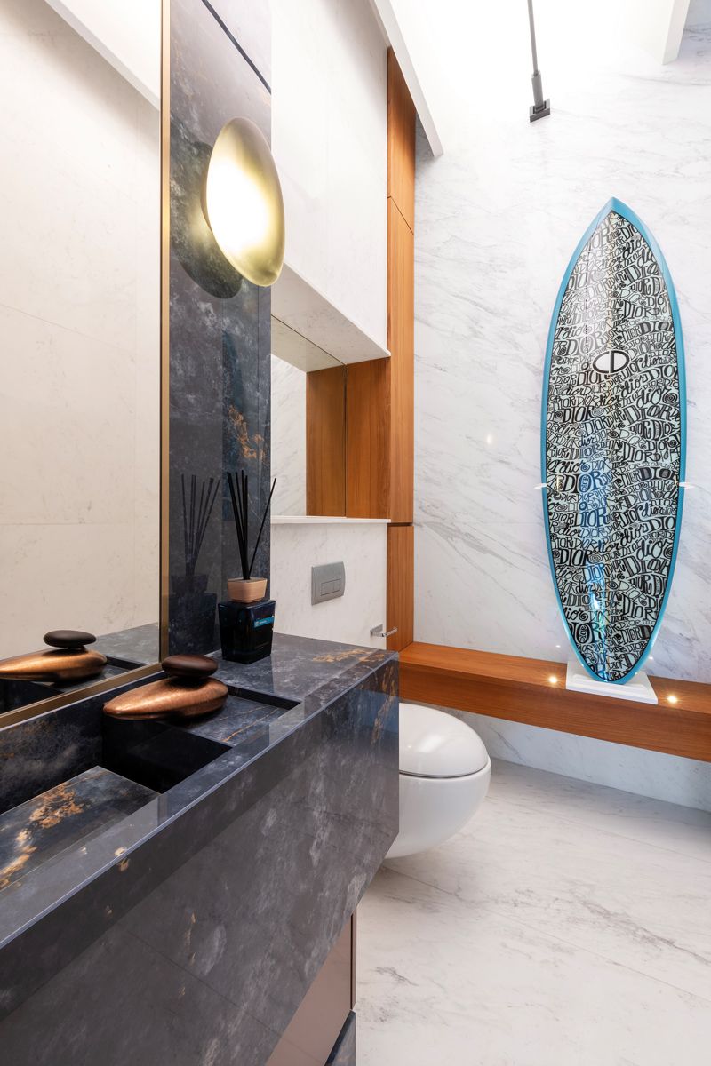 This bathroom pairs a graphic Dior surfboard with Gessi fittings