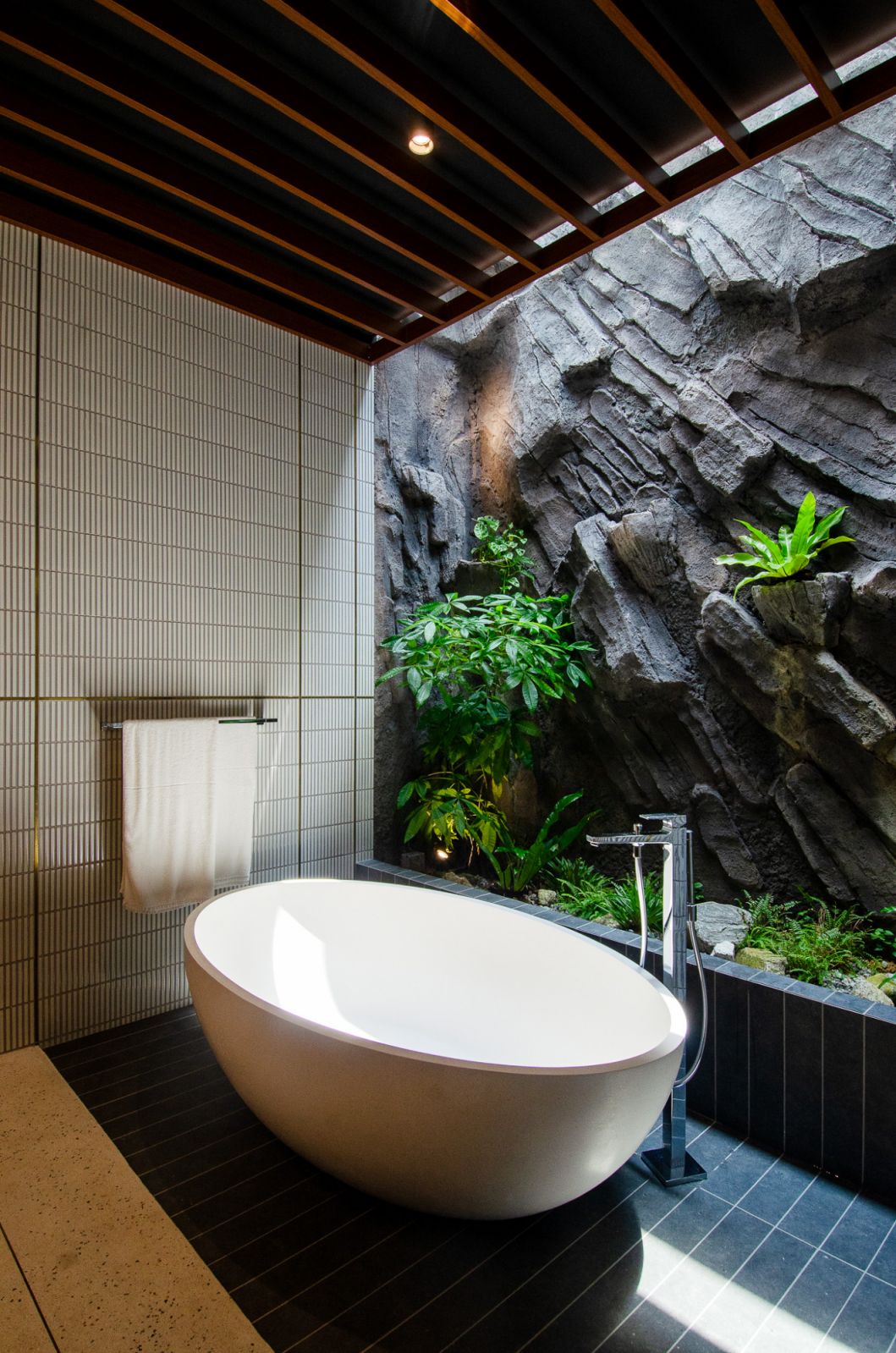 A mix of soft lighting and natural light can transform bathrooms into places of relaxation (Photo: Rupajiwa Studio)