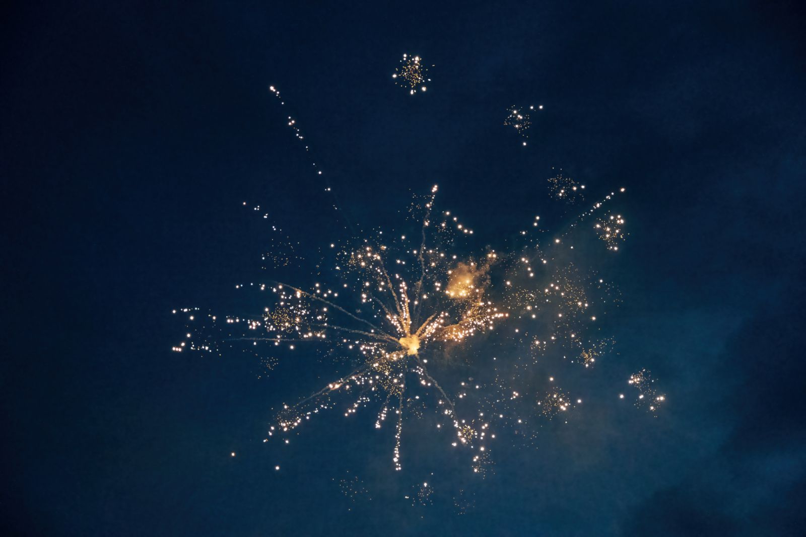 This stunning stock photo captures a spectacular fireworks display, with bursts of vibrant colors illuminating the night sky. The dazzling array of lights and patterns creates a sense of joy and celebration. Perfect for adding excitement and festivity to event promotions, holiday-themed designs, or any project that seeks to capture the magic and wonder of fireworks, this image brings a burst of energy and brilliance to visual storytelling.