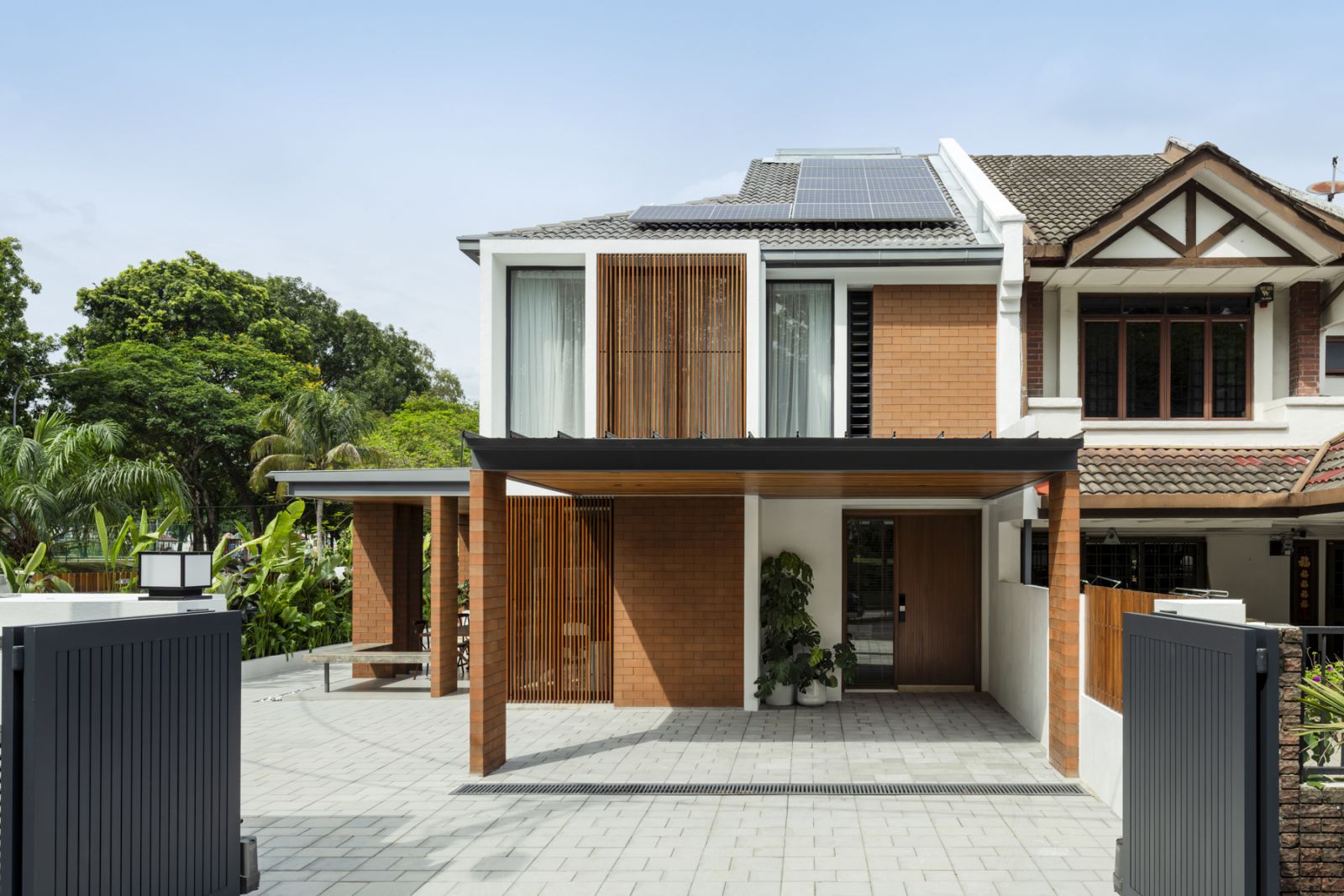 The front facade during daytime reveals the thoughtful integration of traditional and contemporary elements