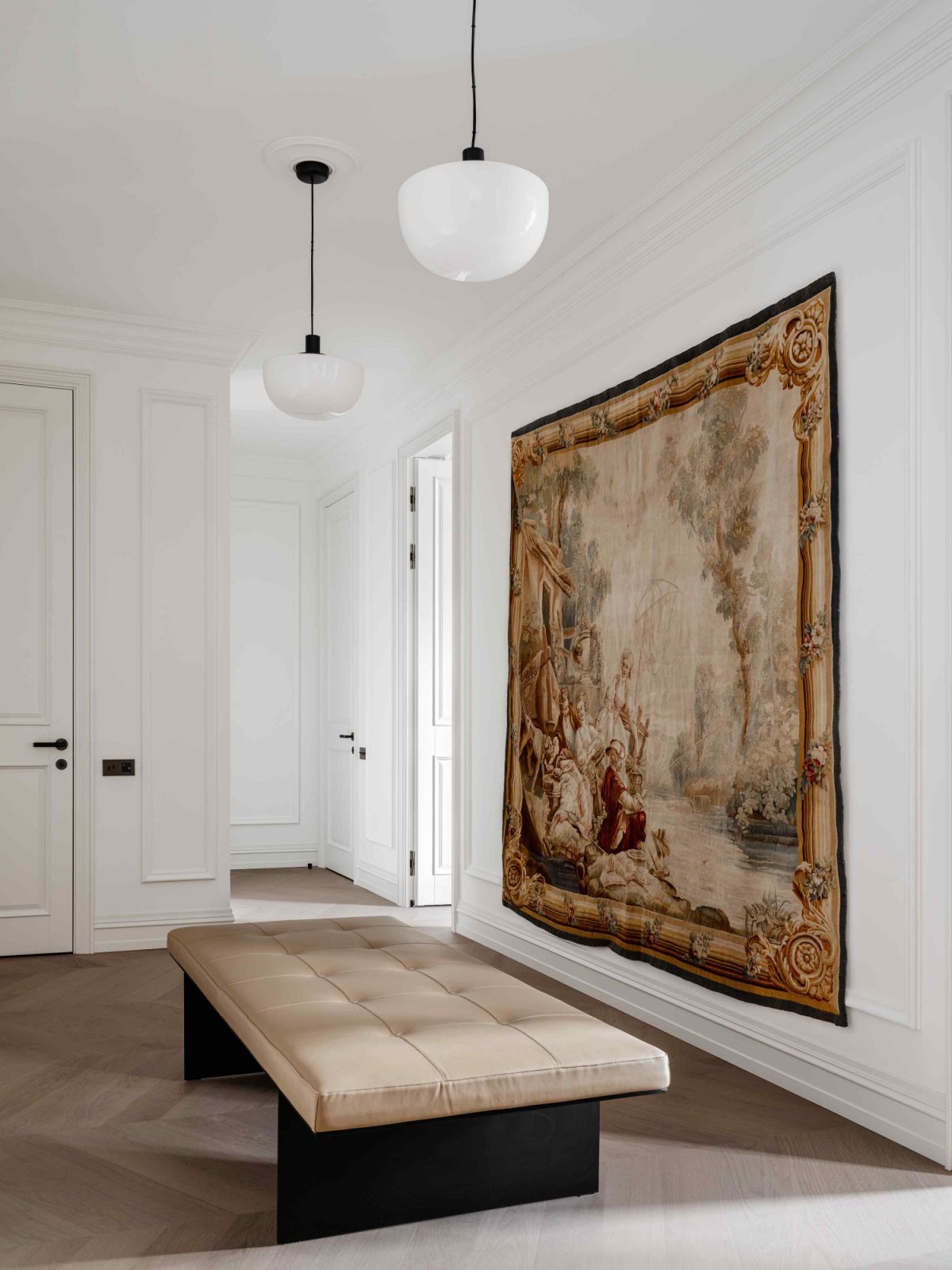 An antique tapestry from Mark Patlis Studio in the entry hall