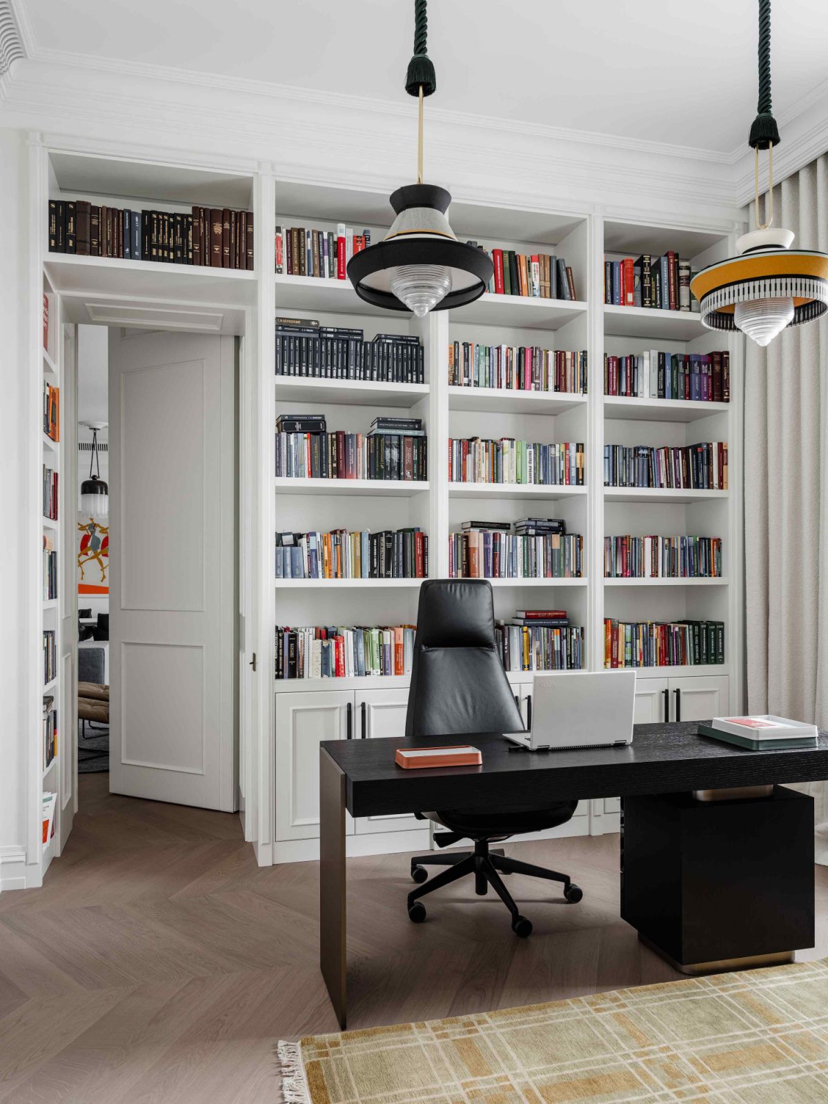 The concealed room reveals more designer hits, such as Jean-Marie Massaud and Poltrona Frau