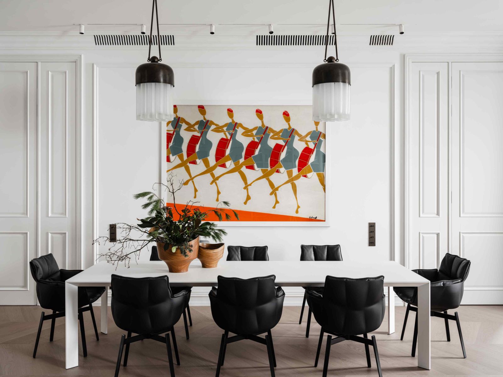 Gorel's colourful artwork from the Uluhanli Gallery is paired with Patricia Urquiola’s Husk chairs in the dining room