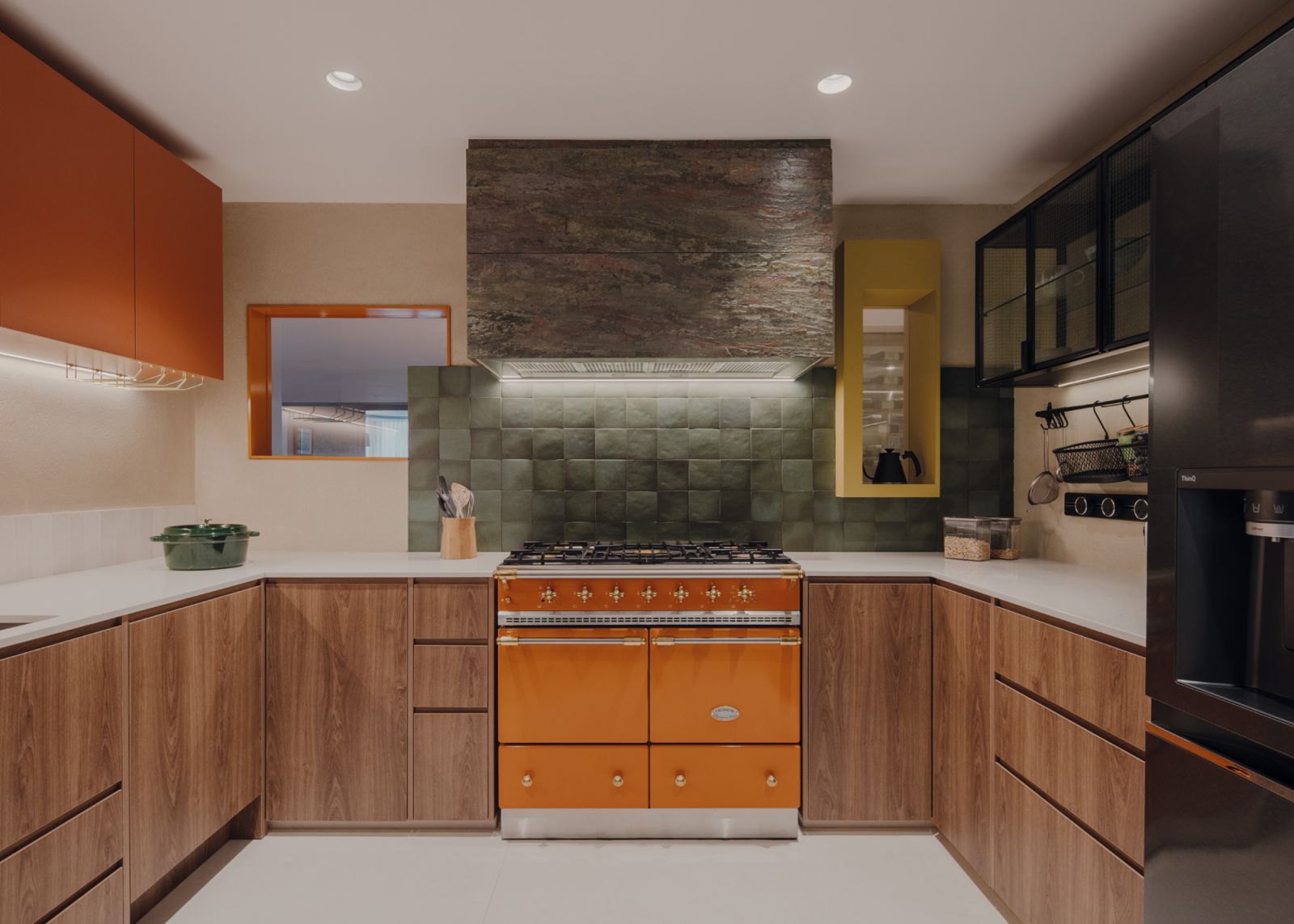 This Miró homage in the kitchen is articulated with orange, deep green and yellow accents, and geometric shapes