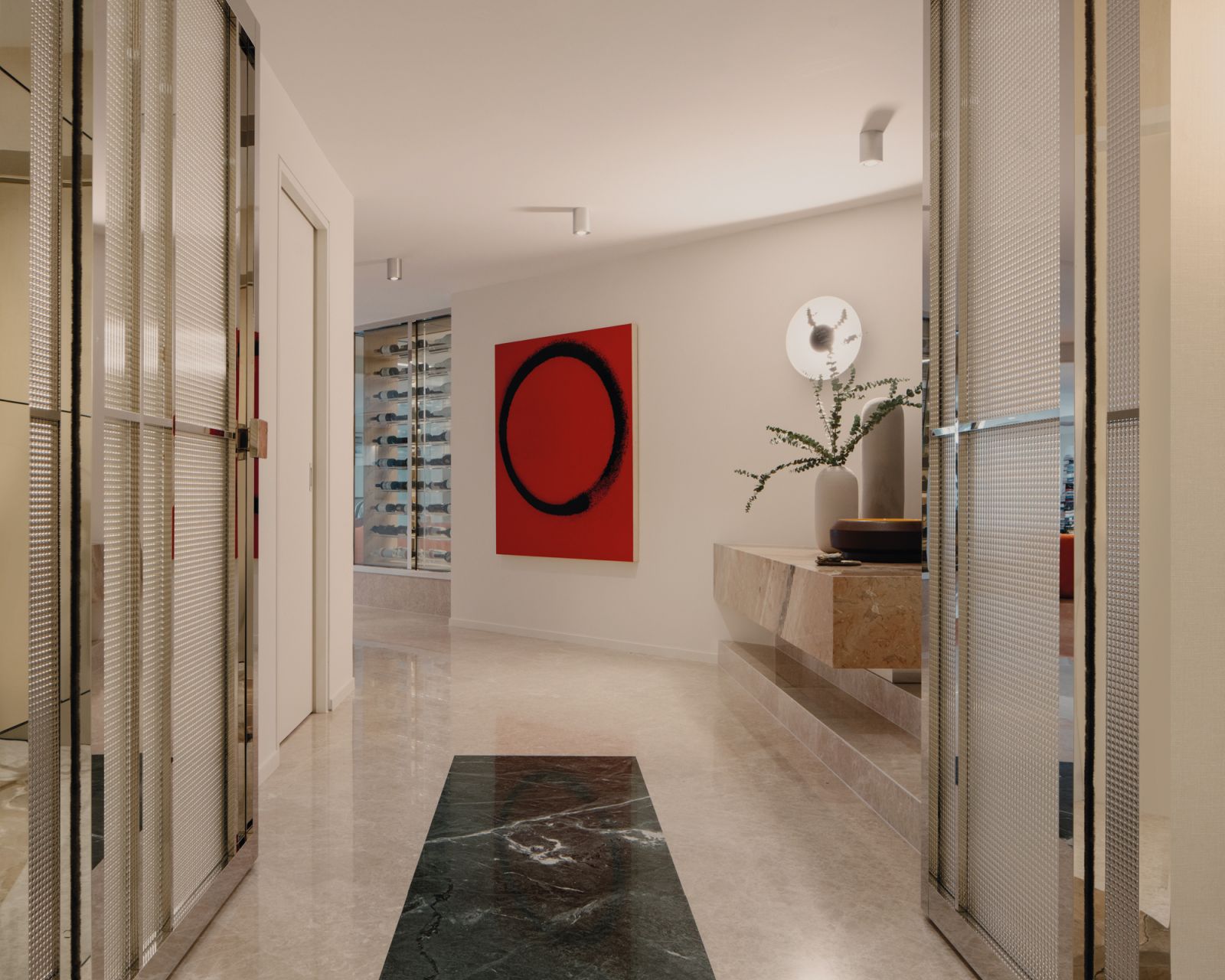 The floor and the artwork’s geometric shapes and colours are subtle nods to Miró