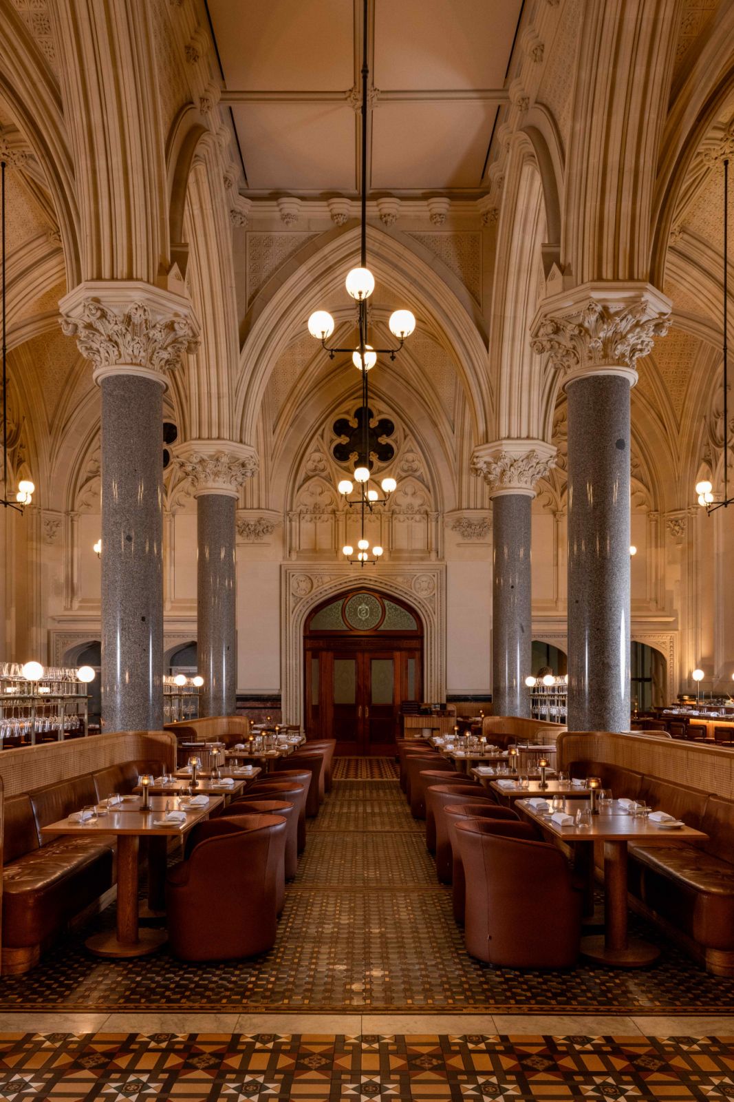 Limestone walls, solid grey granite columns and vaulted ceilings
