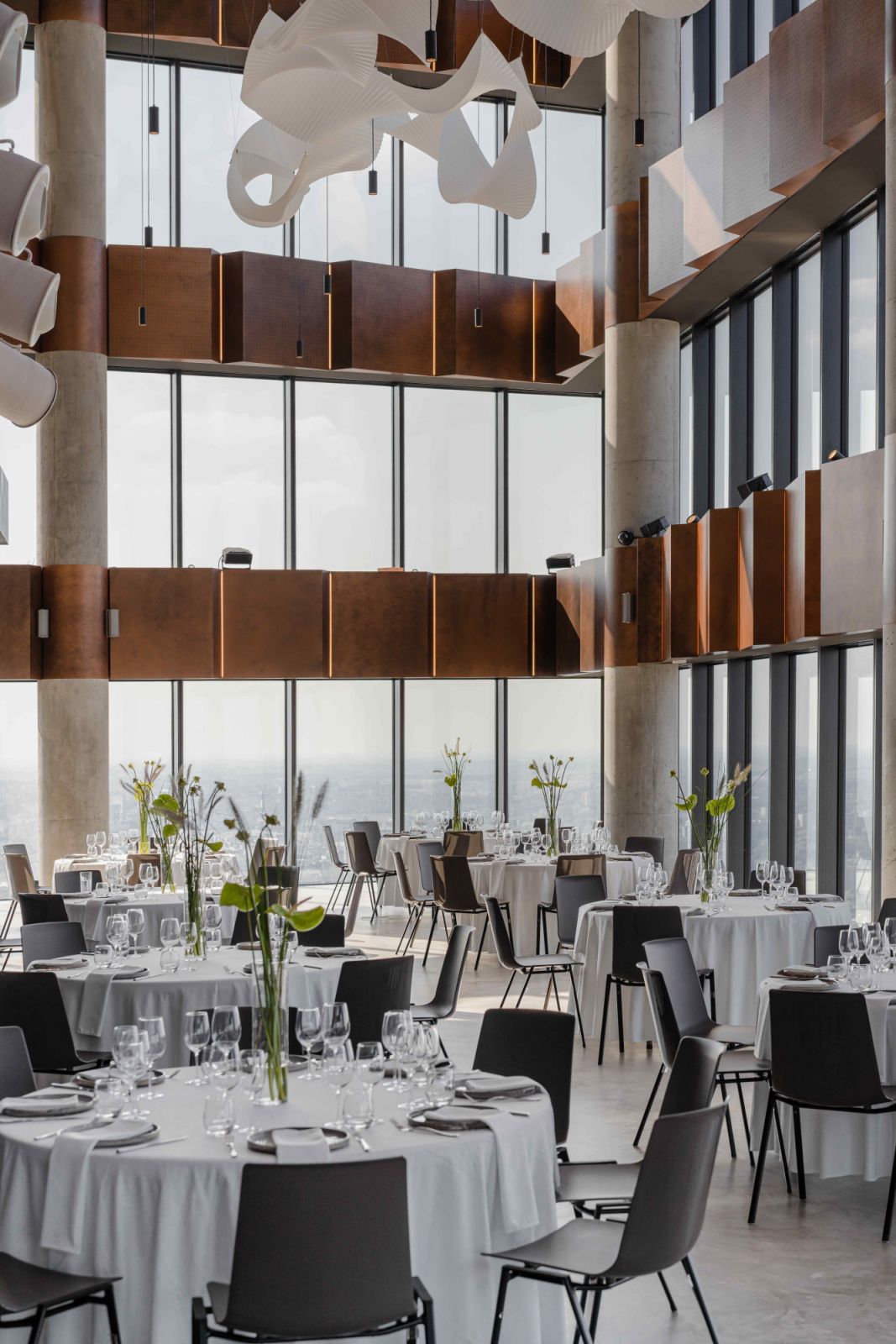 Ribbon installations in the event space appear to swirl in mid-air