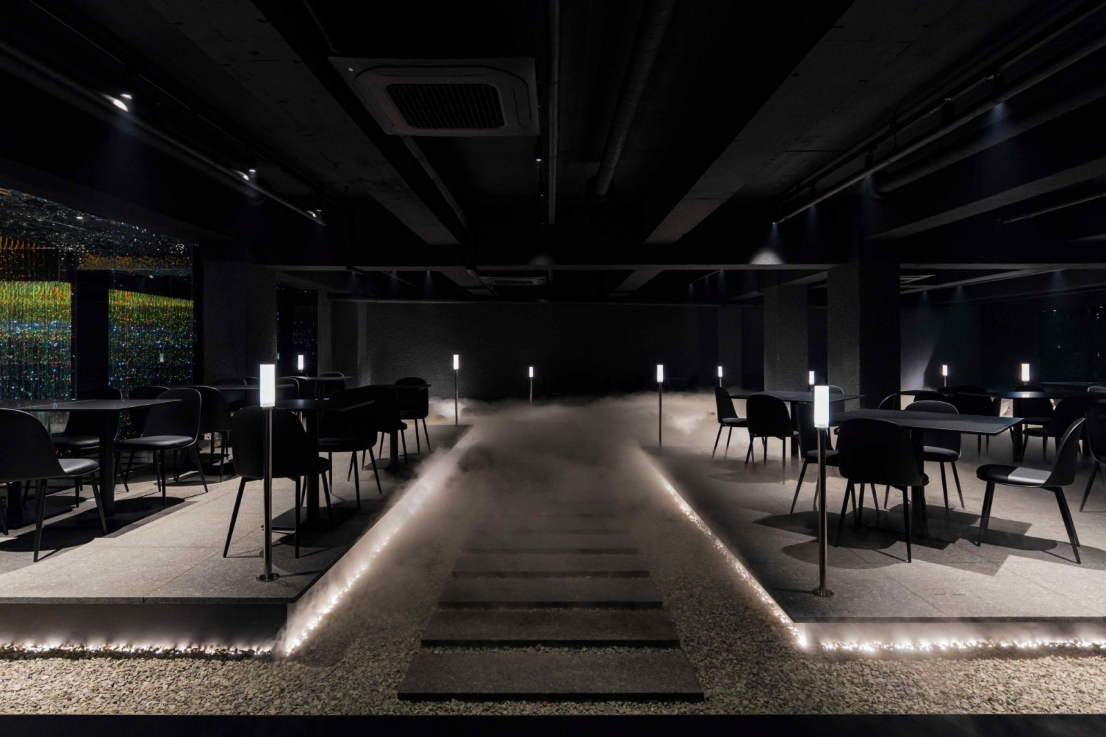 Flowing water elements and mist-covered flooring