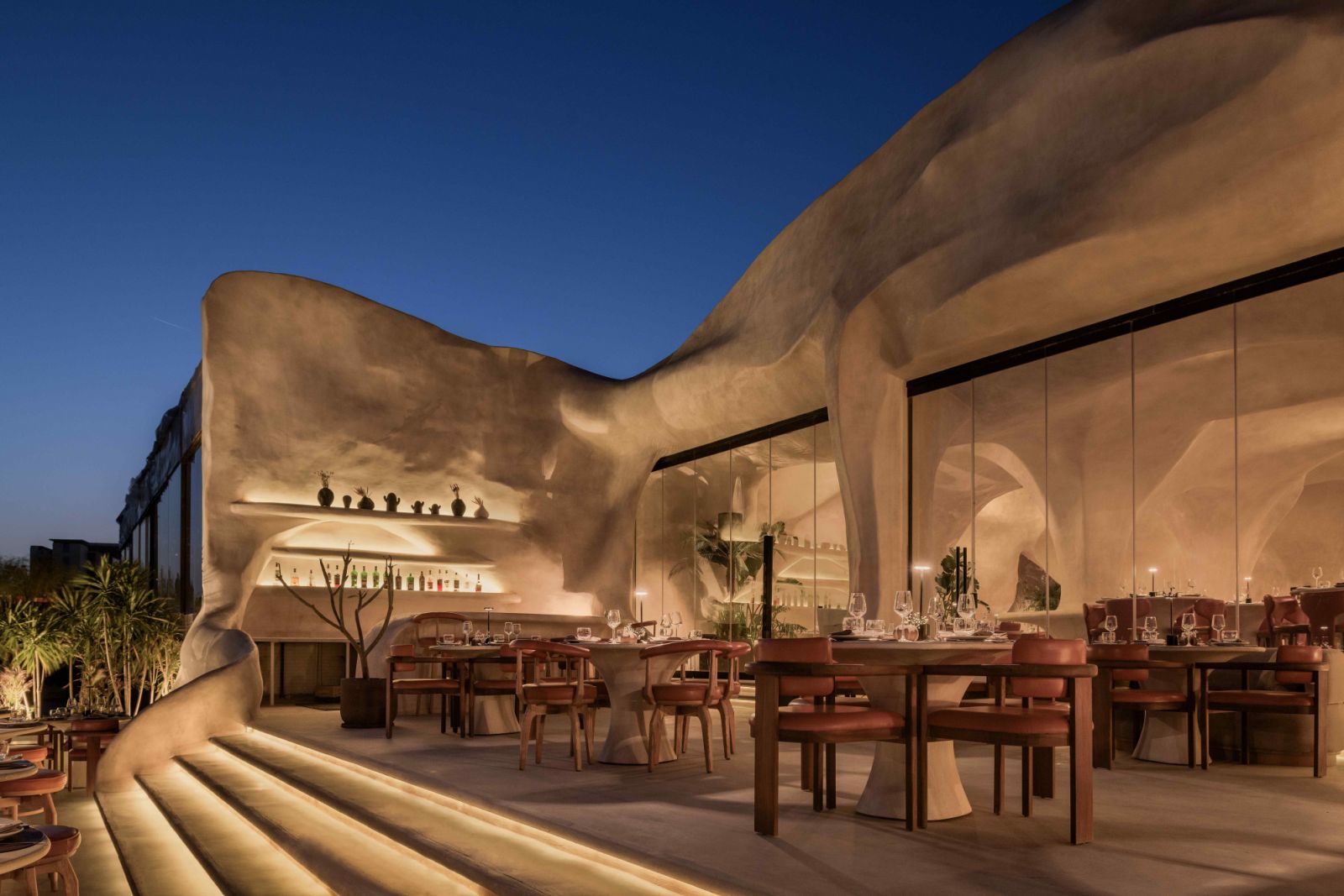 The structure is layered with stucco to achieve the organic aesthetic