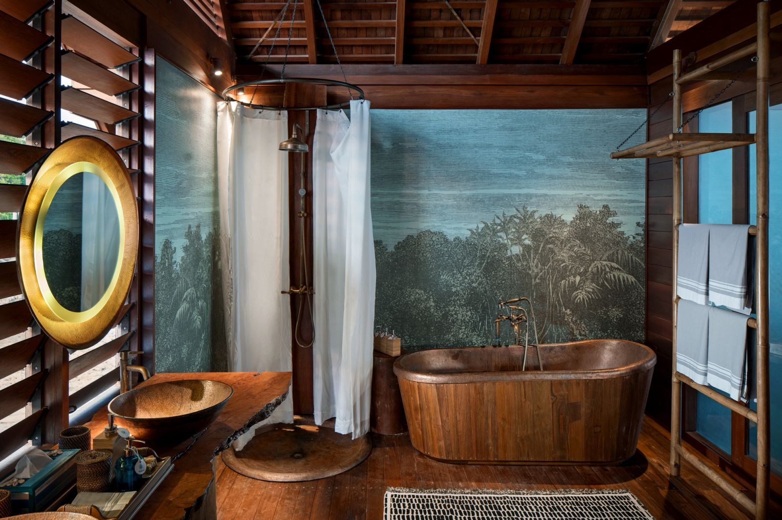 Overwater bungalow bathroom at Bawah Reserve
