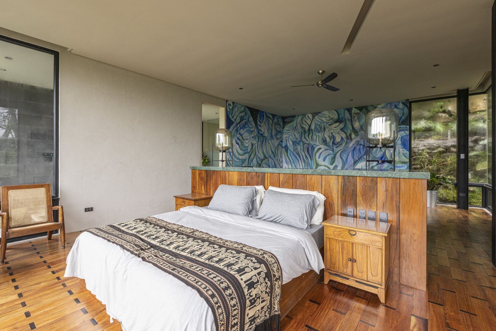 One of the guest rooms, featuring a mural that echoes the sea and the forest