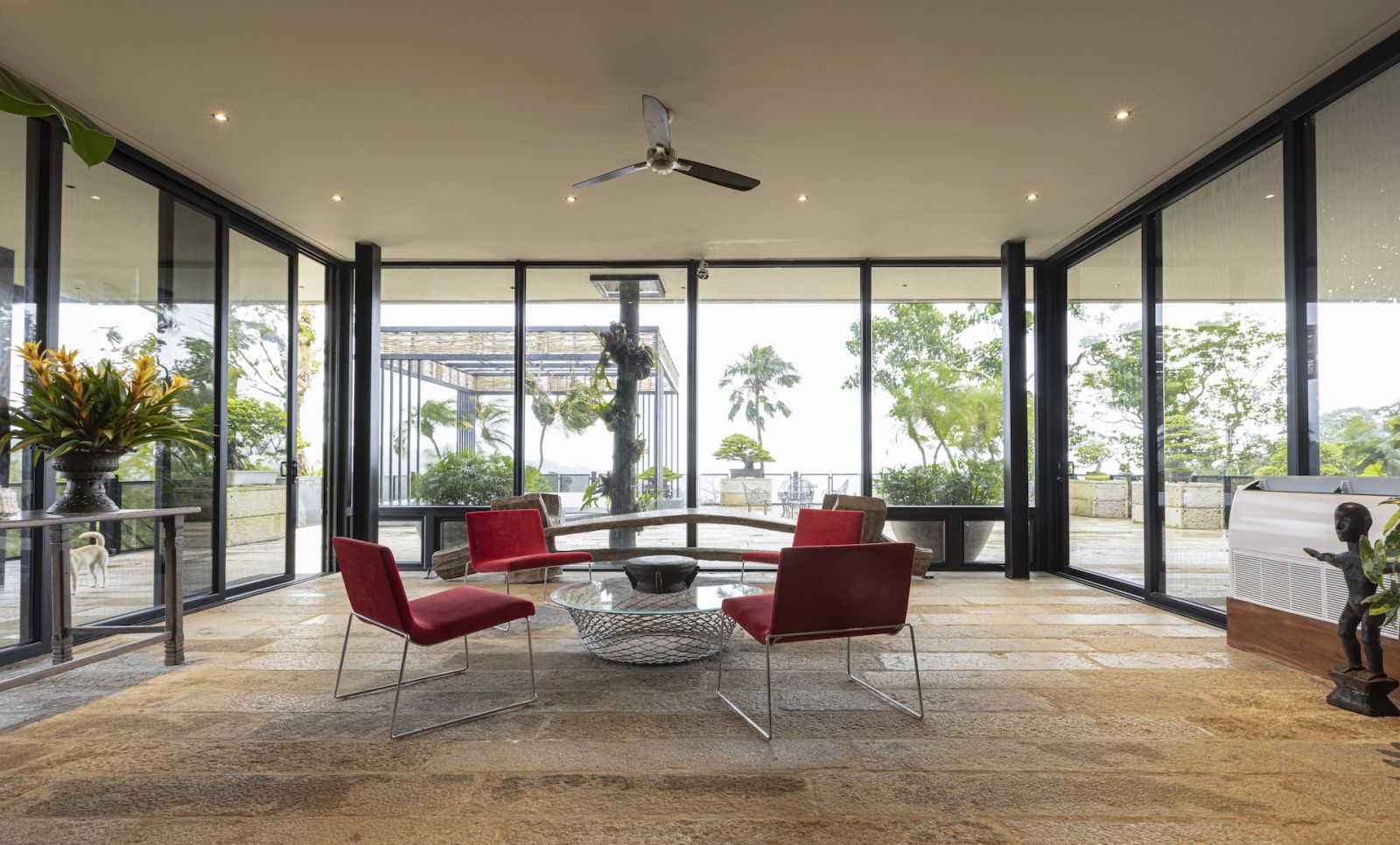 A glimpse of the homeowner's collection of Italian furniture, alongside a hundred-year-old bench