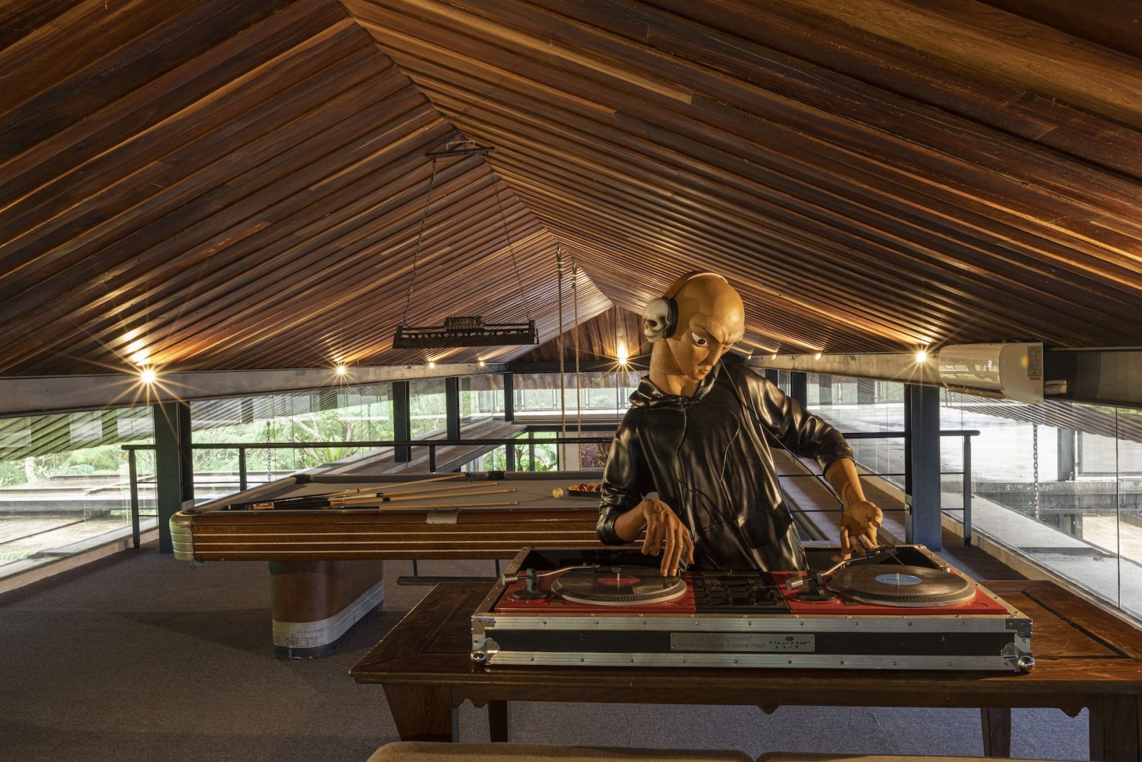 The hobby lobby, featuring a billiards table and an Elmer Borlongan sculpture