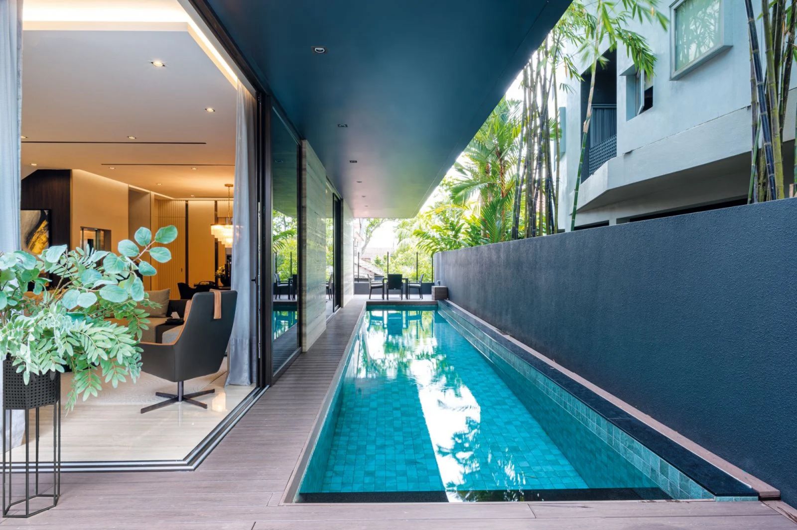A lap pool lines the outside of the house