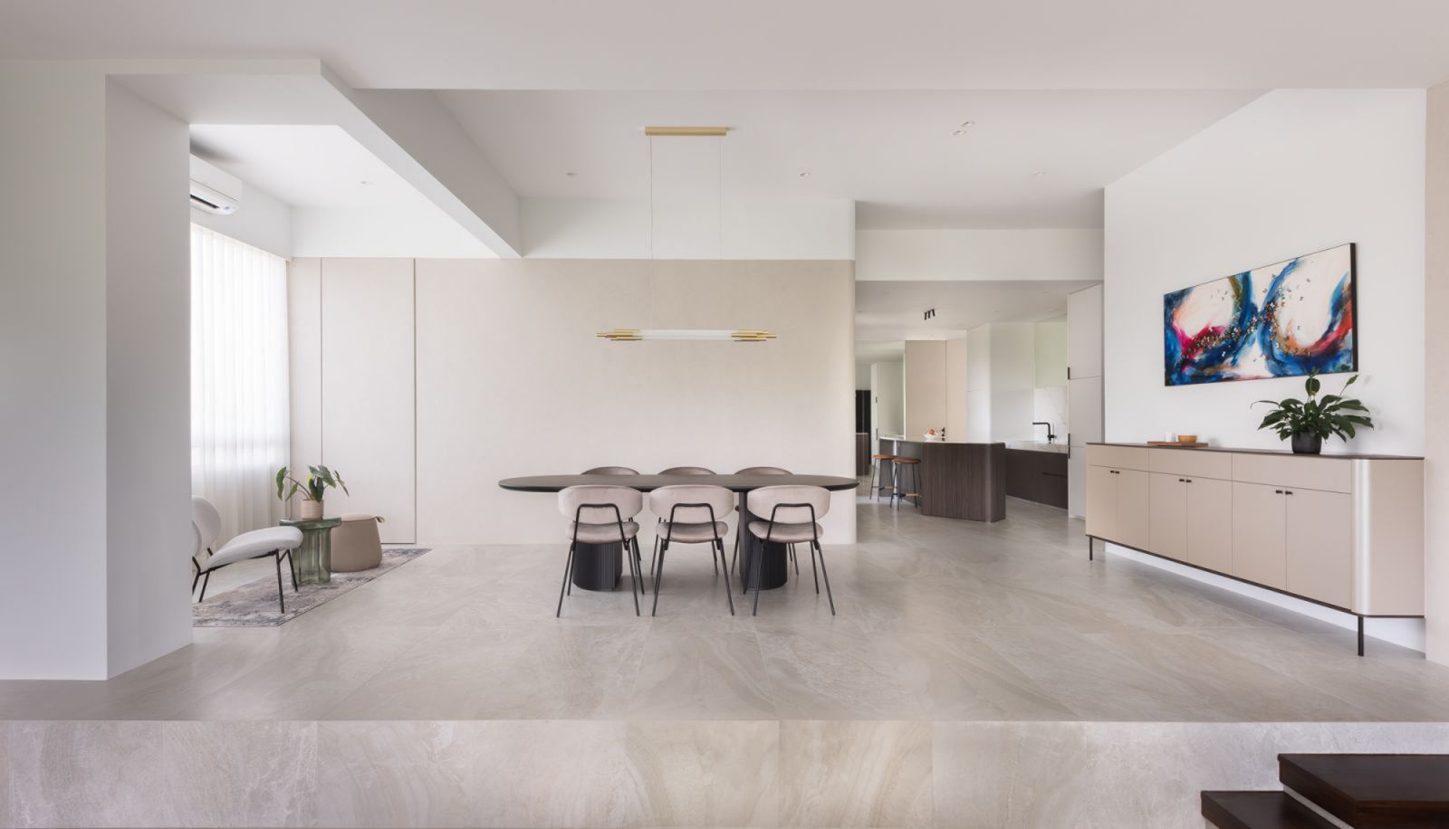 The home’s open-concept dining area connects to the living room and dry kitchen