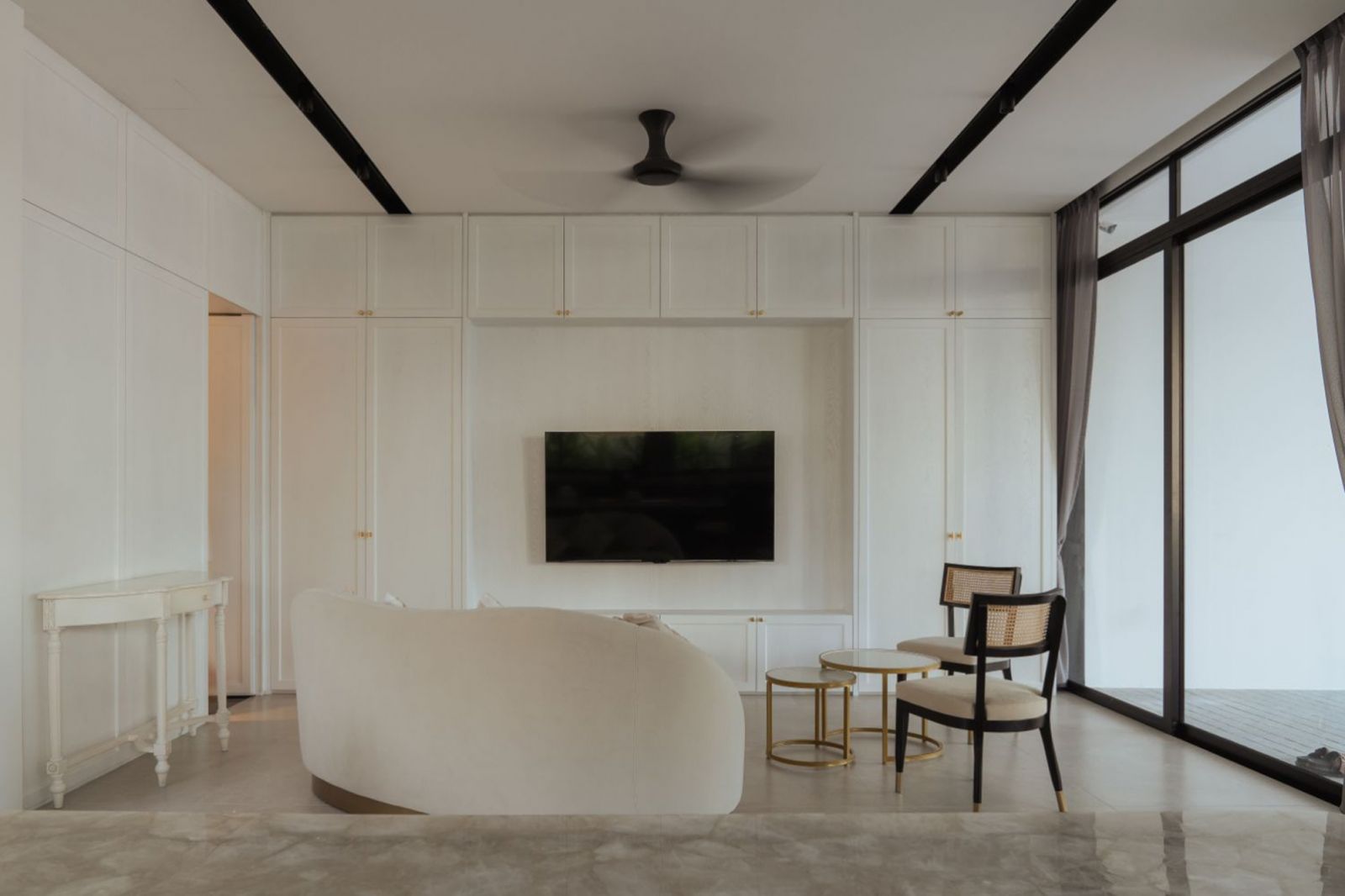 A serene living oasis with a clean white architectural shell and minimalist furniture