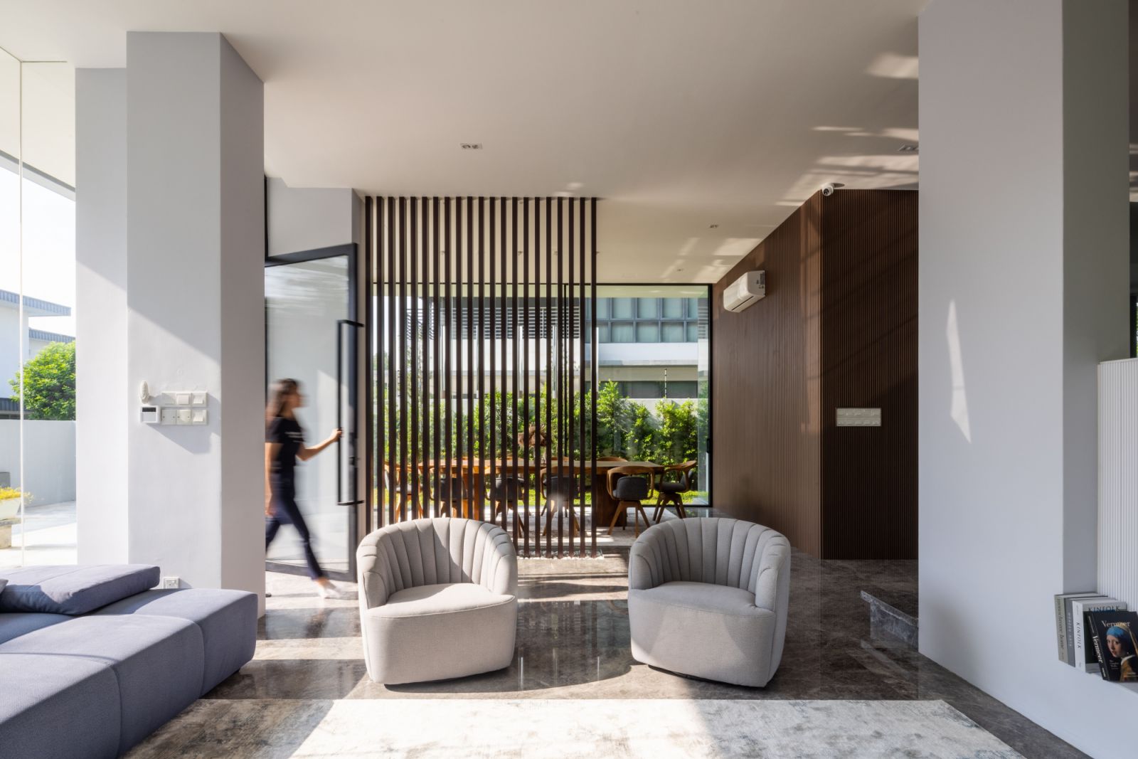 Custom-designed furniture by the homeowner, who is also a furniture retailer, complements the home's clean architectural lines and open-plan layout