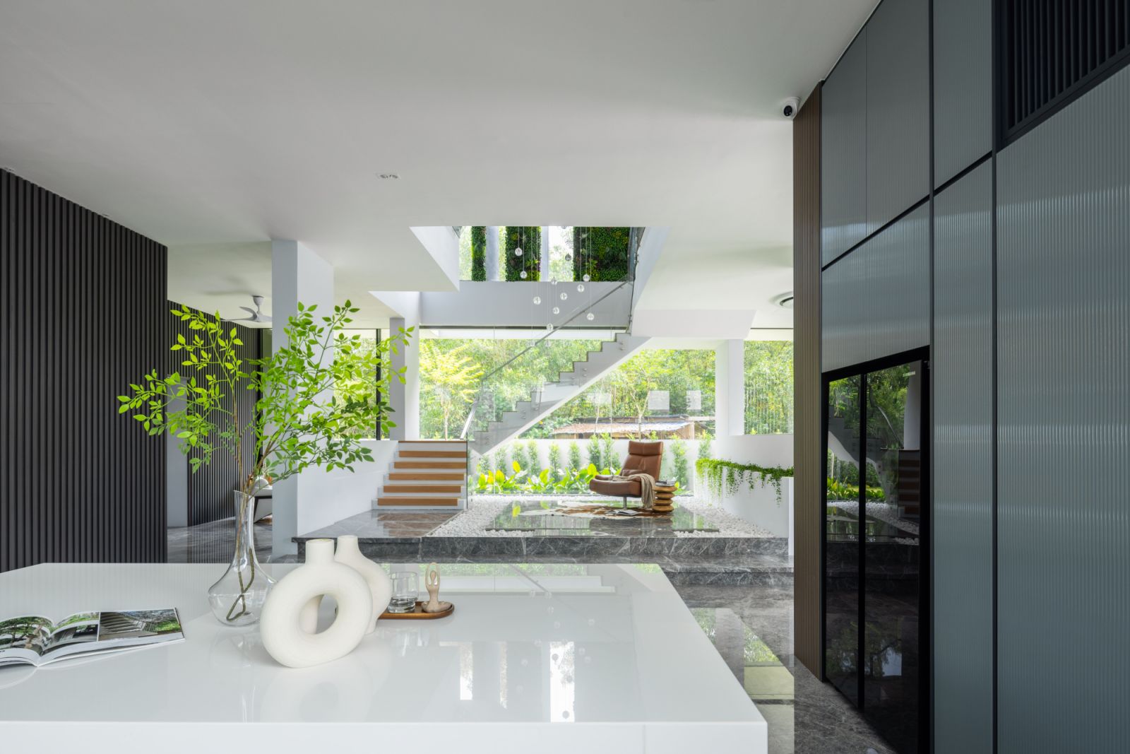 Custom-designed furniture by the homeowner, who is also a furniture retailer, complements the home's clean architectural lines and open-plan layout