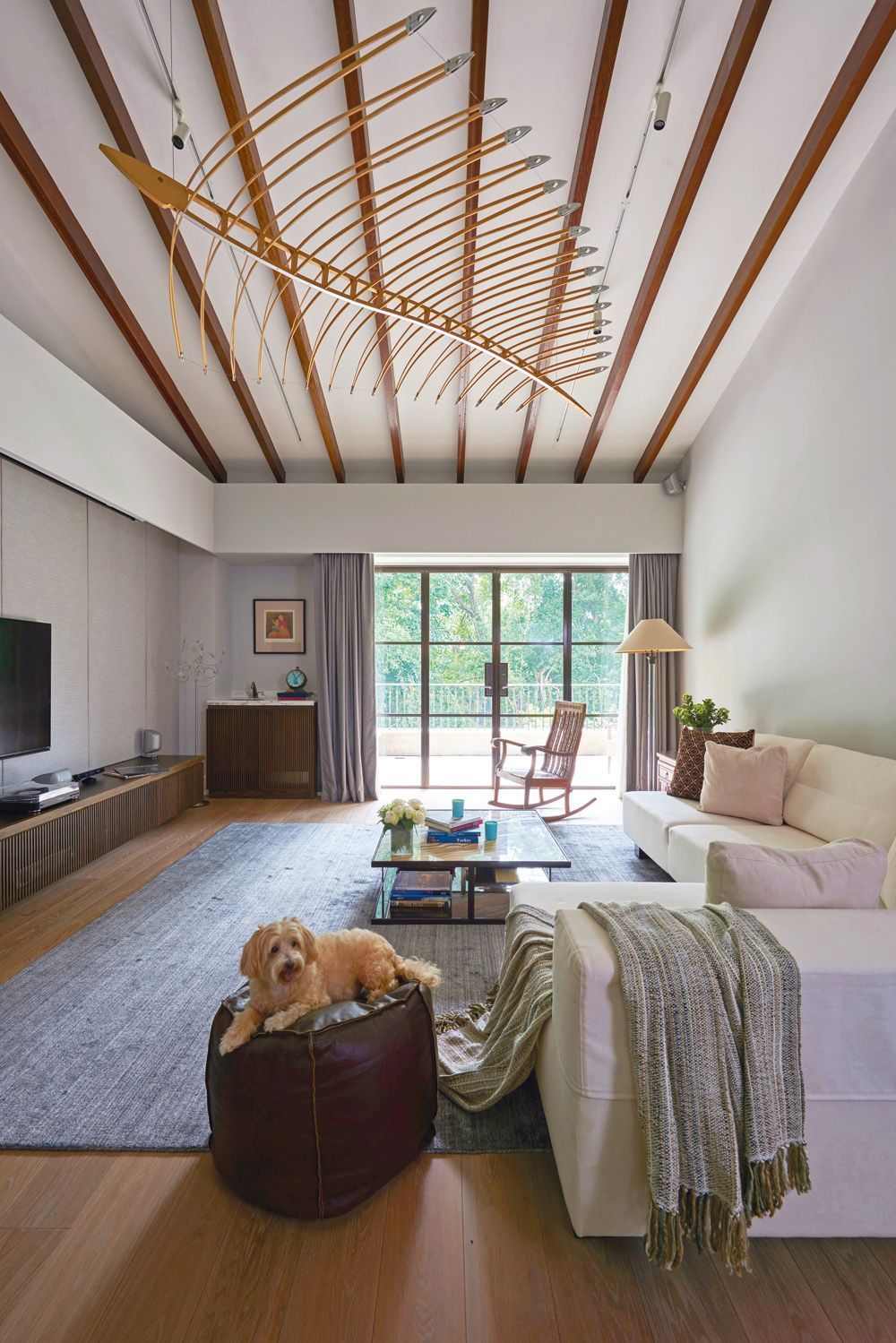 A striking sculpture floats above the family room