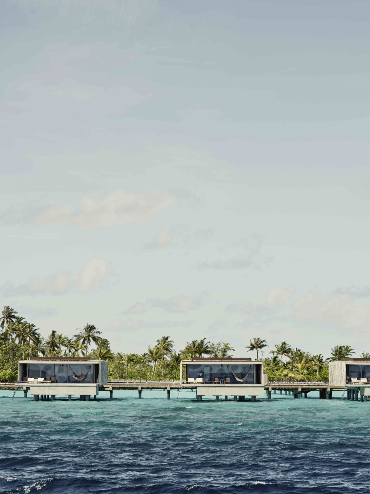 Water villas exterior at Patina Maldives