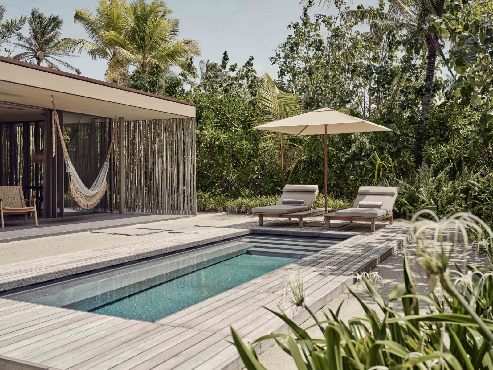 One-bedroom beach pool villa exterior at Patina Maldives