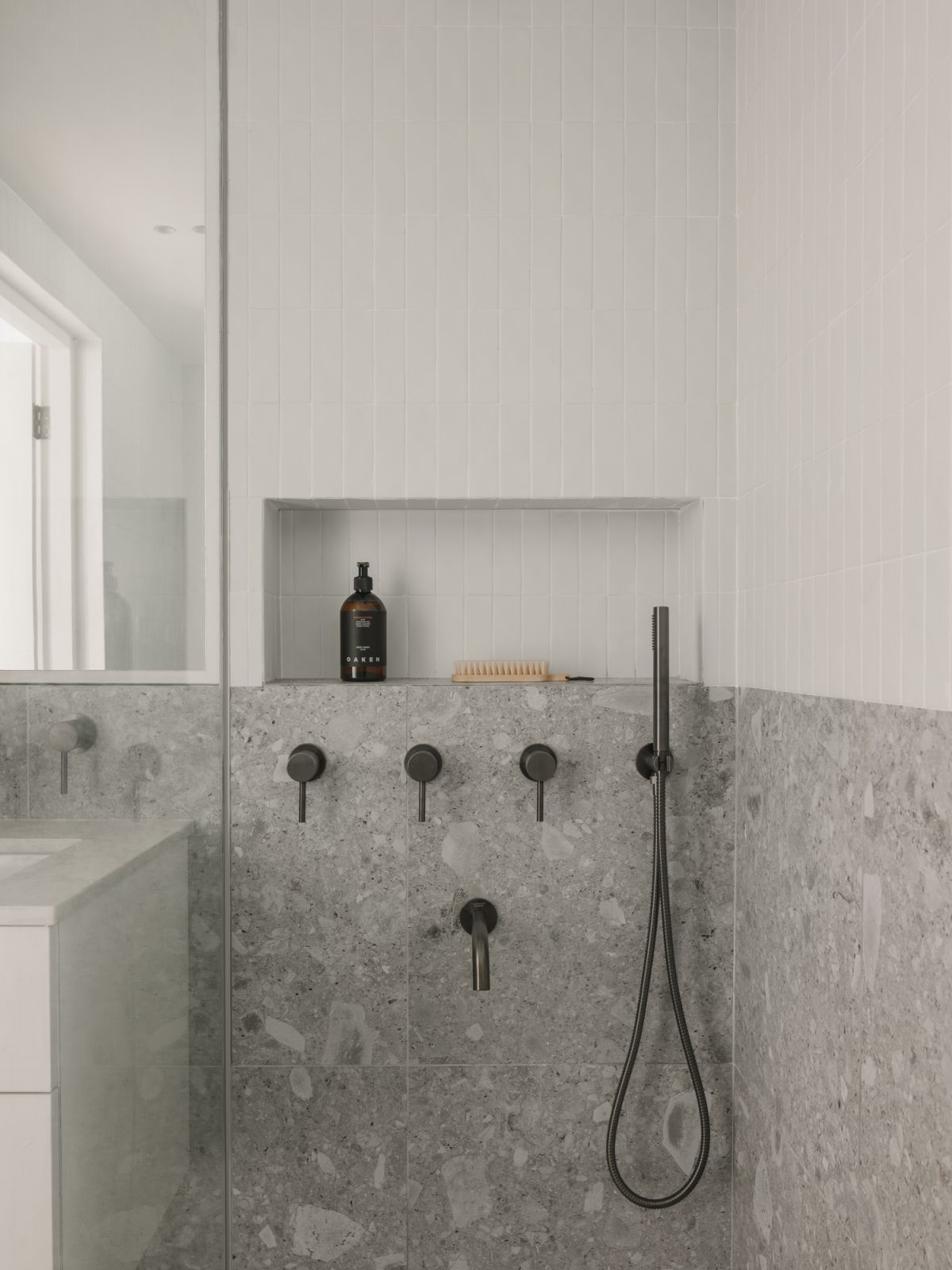 The pared-back bathroom design in the Hazel Park condominium apartment