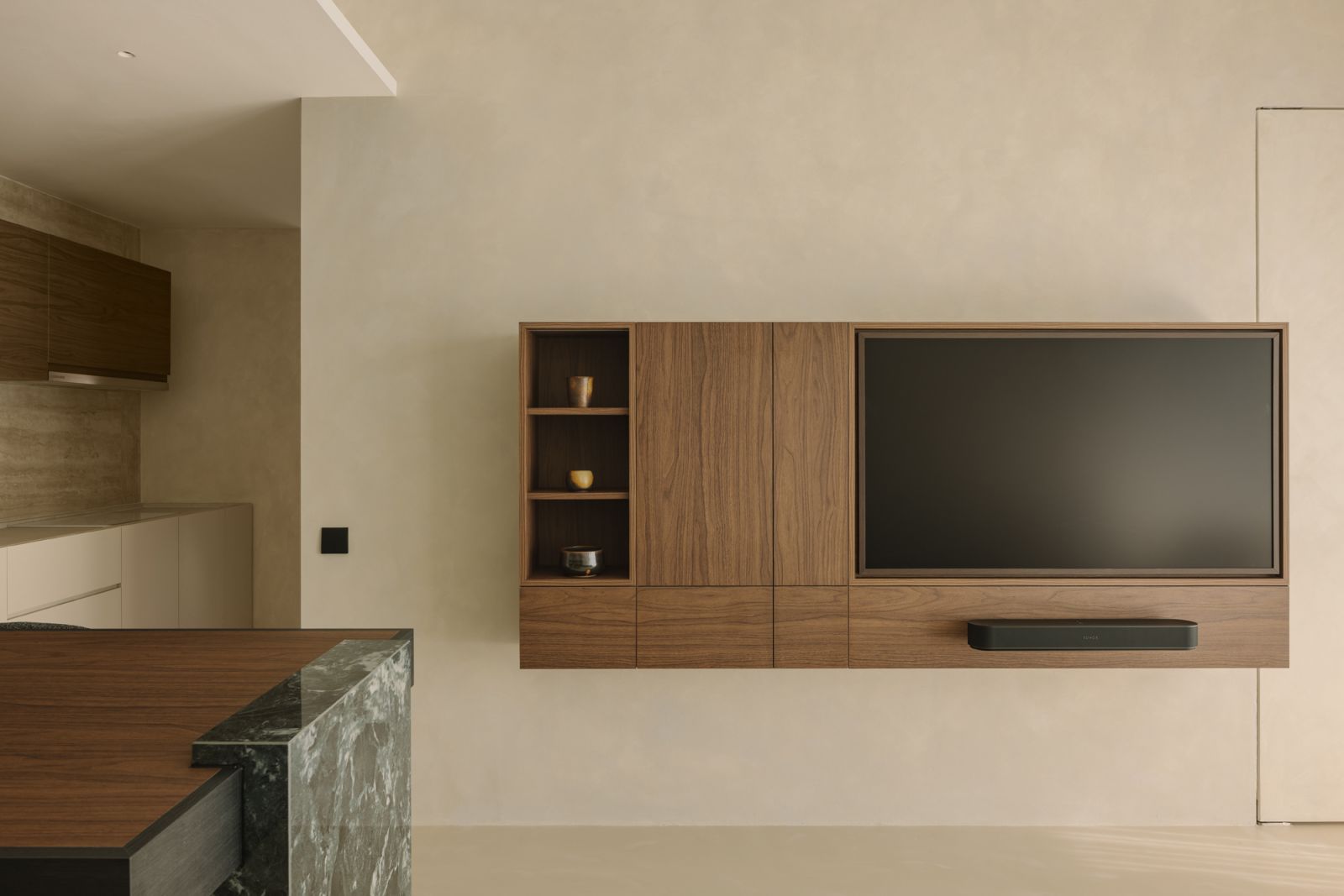 The feature wall and mounted console in the Leonie Hill living room