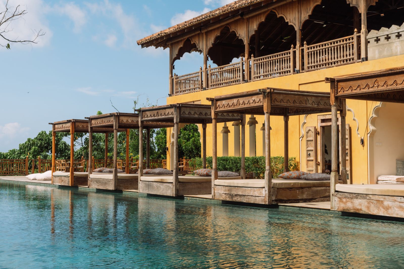 Infinity pool sun loungers at Malabar Hill
