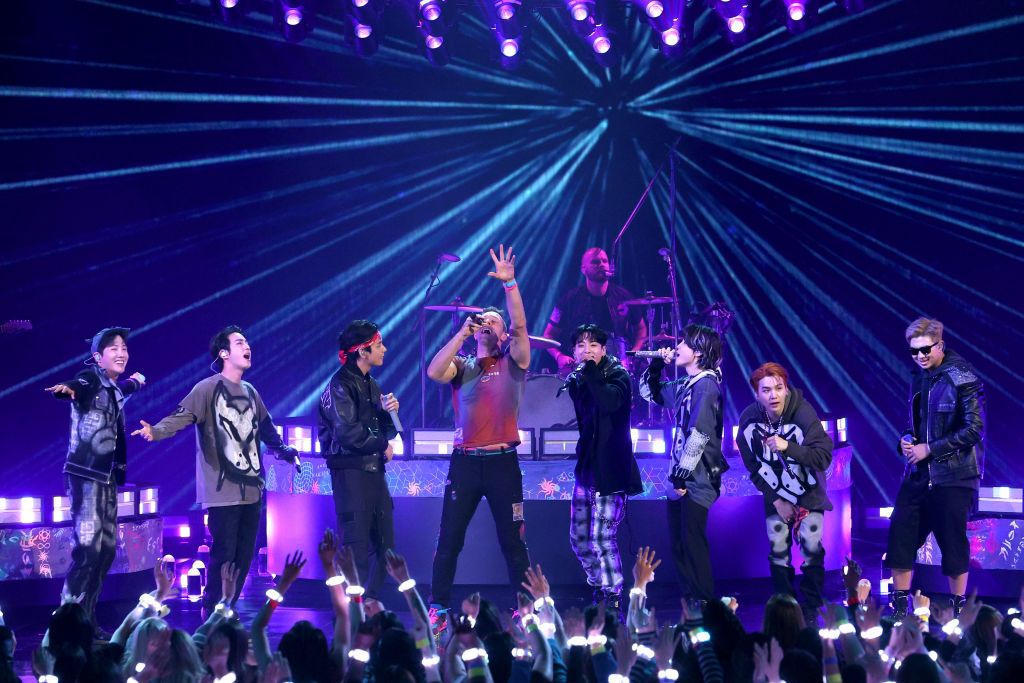 Coldplay’s Chris Martin and BTS members (from left) J-Hope, Jin, V, Jungkook, Jimin, Suga, and RM of BTS perform onstage during the 2021 American Music Awards (Photo: Getty Images)