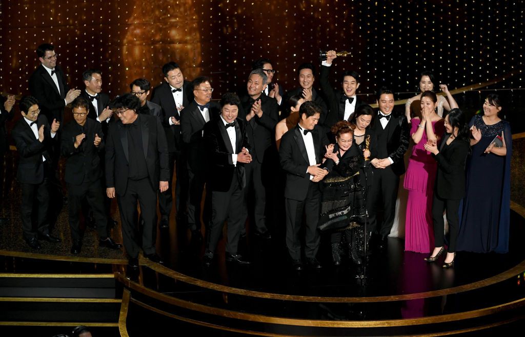 ‘Parasite’ cast and crew accept the Best Picture award onstage during the 92nd Annual Academy Awards (Photo: Getty Images)