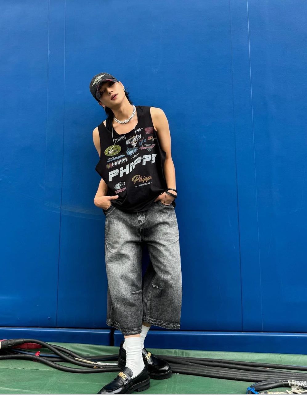 Ateez’s Woo-young elevates his edgy look with a Versace Medusa Chain necklace (Photo: Instagram /@wooyounggg__)