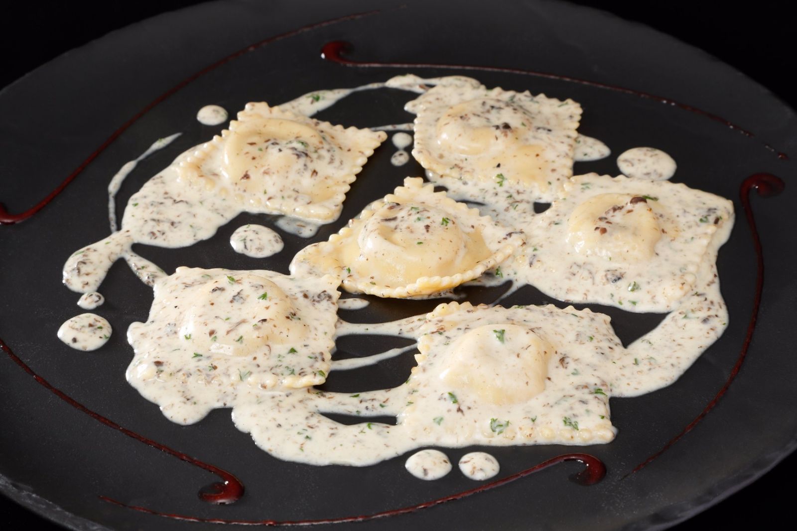 Ravioli ripieni di foie gras in salsa di tartufo at Lenzi Tuscan Kitchen