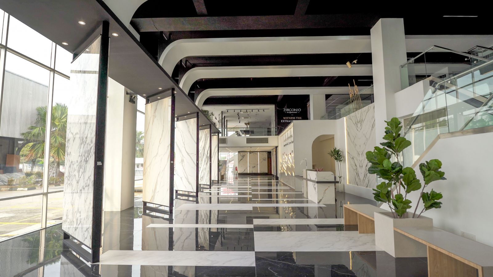 The sleek black-and-white colour scheme sets a refined backdrop for Niro Ceramic’s extensive tile designs in their new Shah Alam showroom