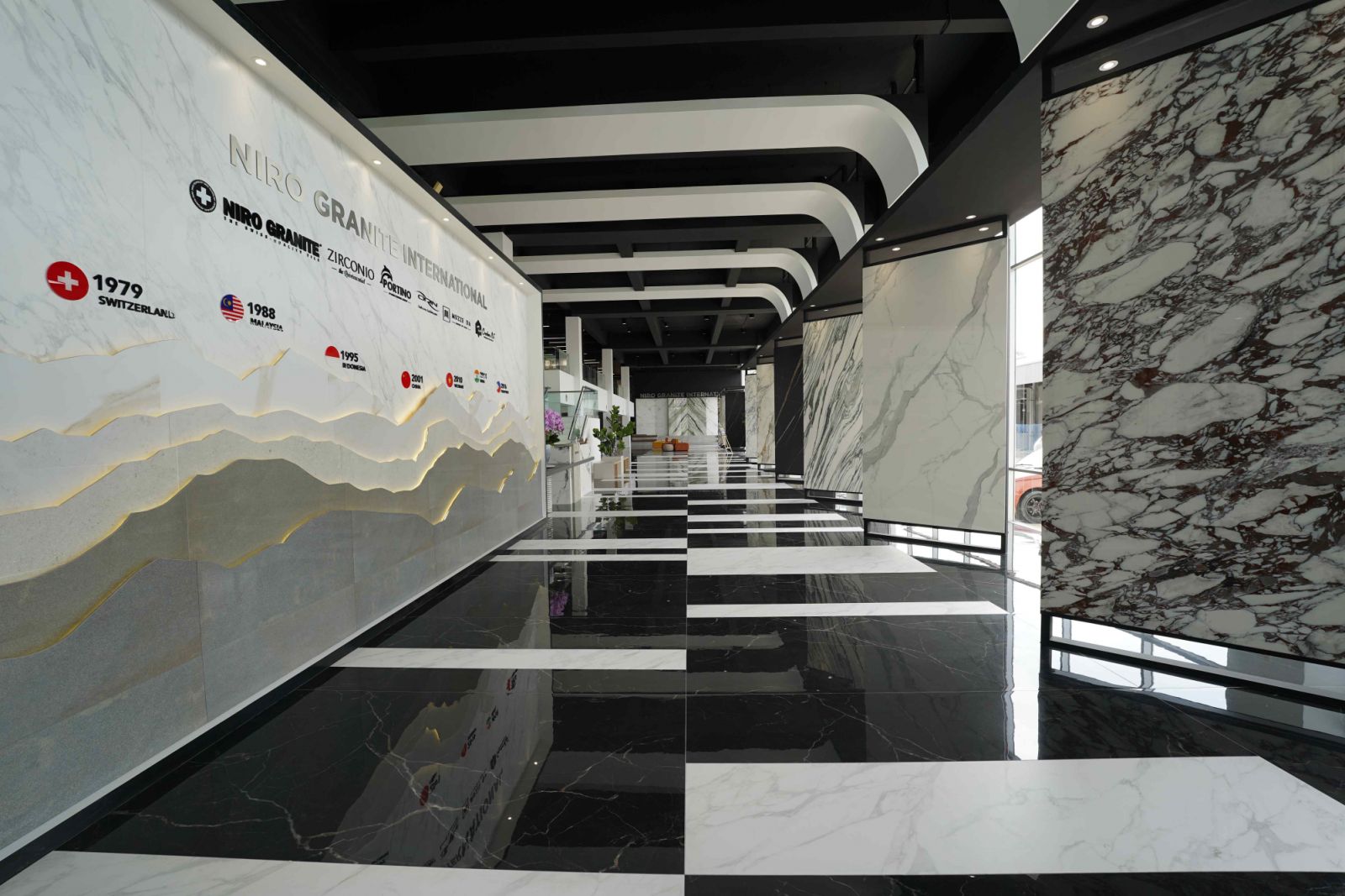 The Alps feature wall at the entrance constructed entirely from leftover tiles