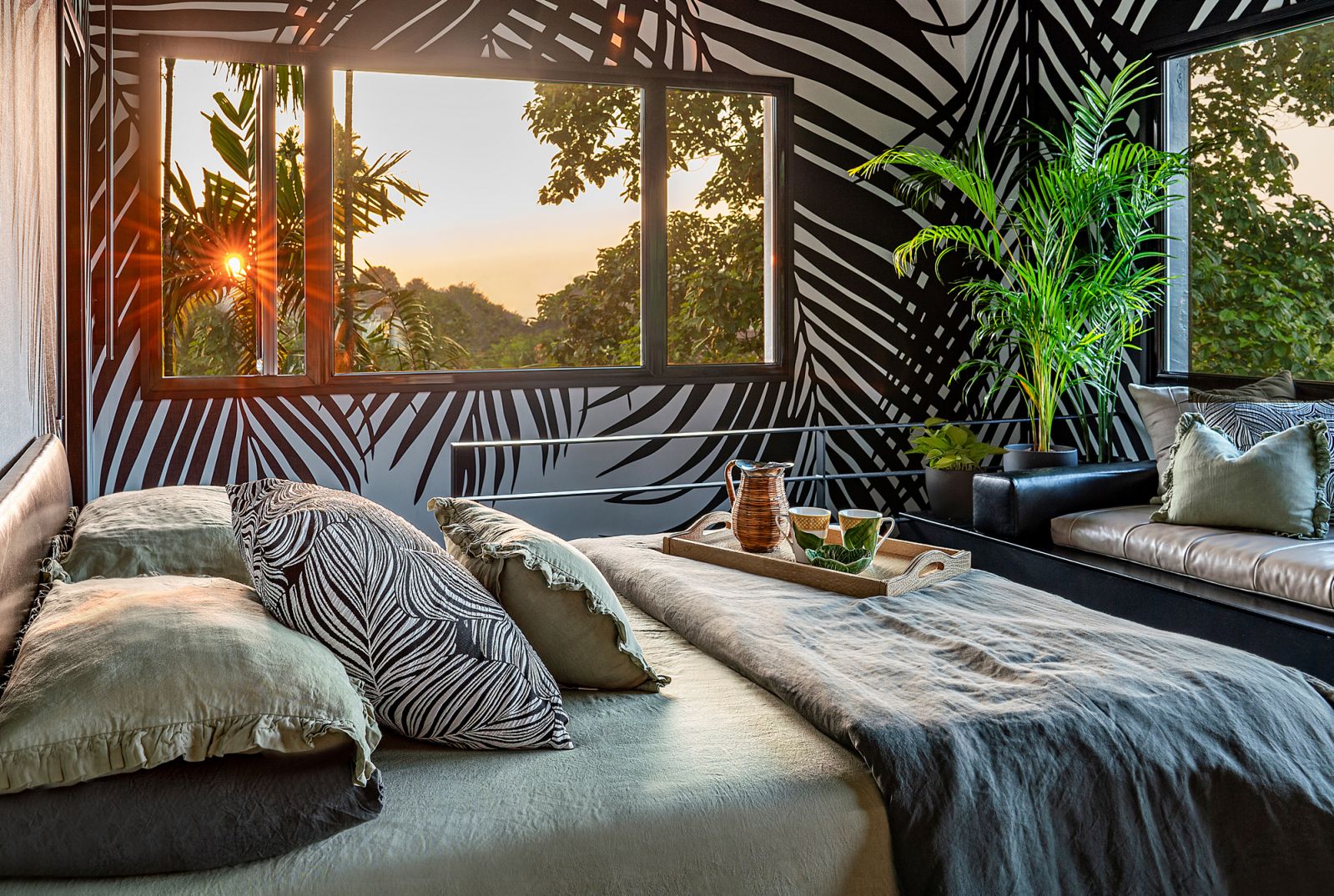 The décor of this bedroom echoes its lush surroundings; connecting with nature has been shown to have a restorative effect on mind, body and soul