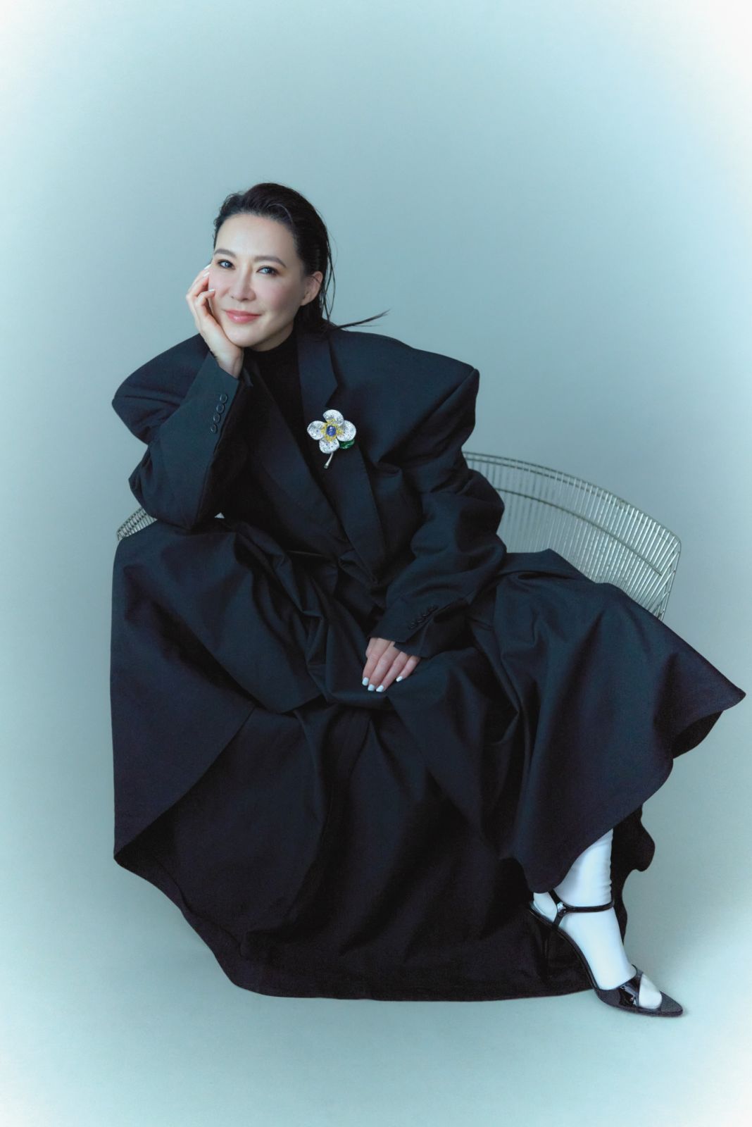 Cindy Chao wearing a Balenciaga blazer, turtleneck, skirt, shoes and CINDY CHAO The Art Jewel White Label Collection Sapphire Floral Brooch (Photo: courtesy of Ming Shih Chiang)