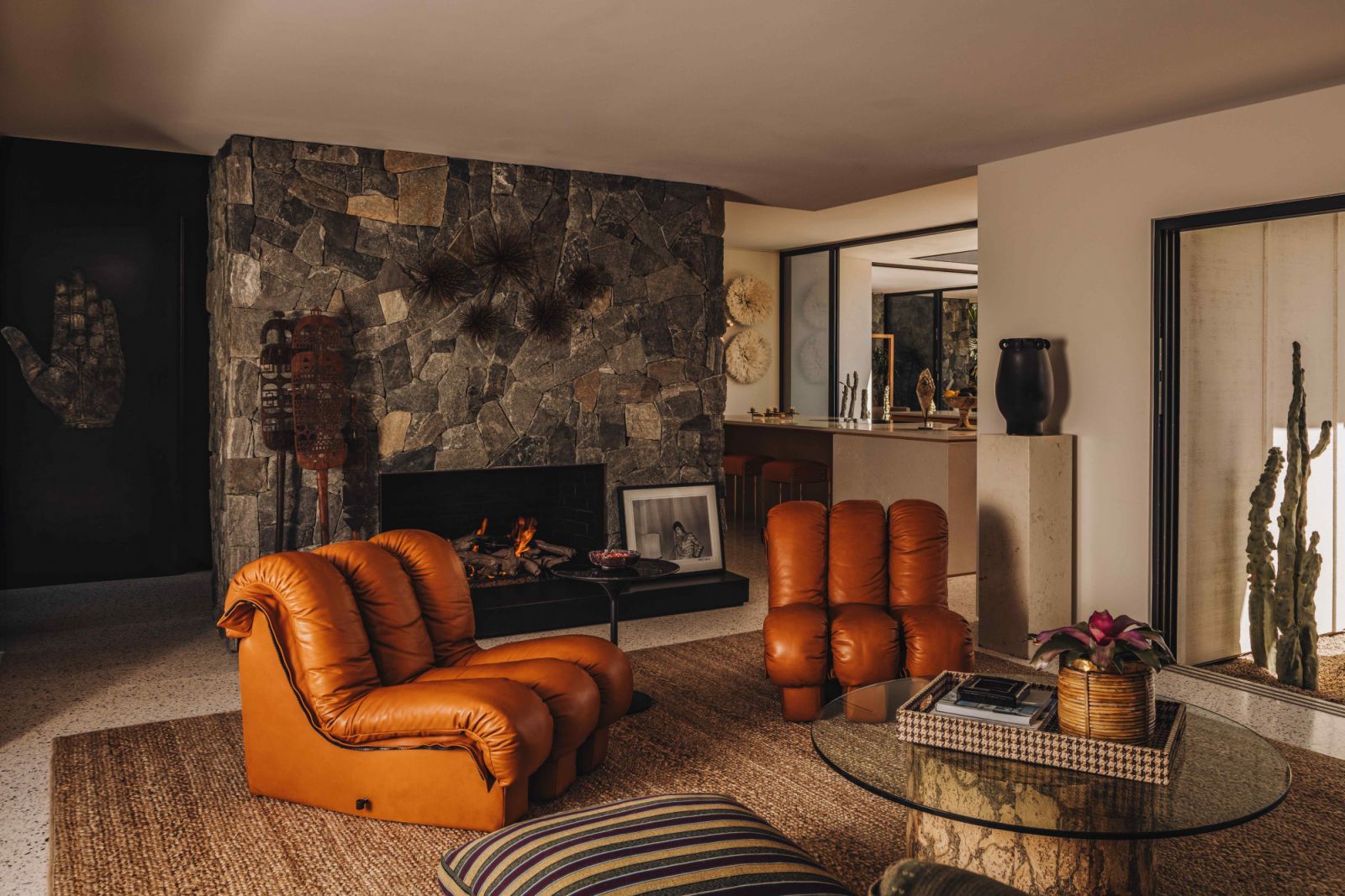 The living room is distinctly rooted in the era’s indulgent desert resort elegance