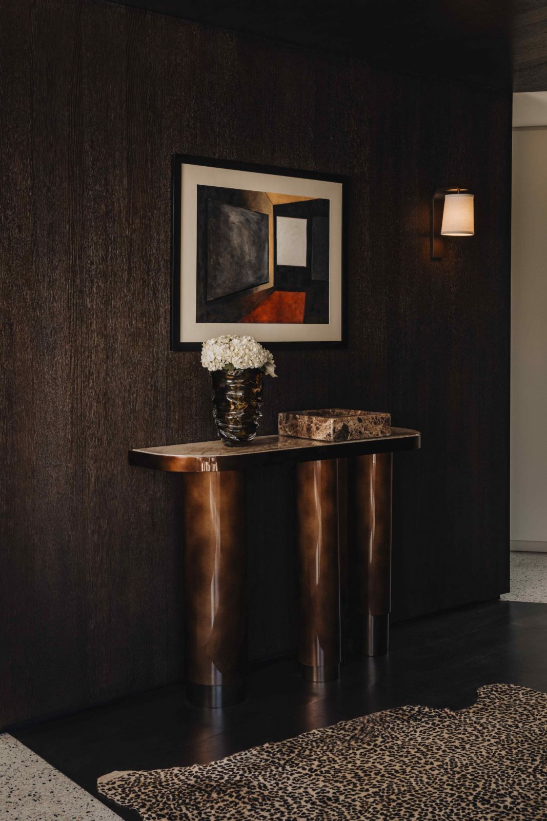 An onyx and bronze console and mid-century art pieces