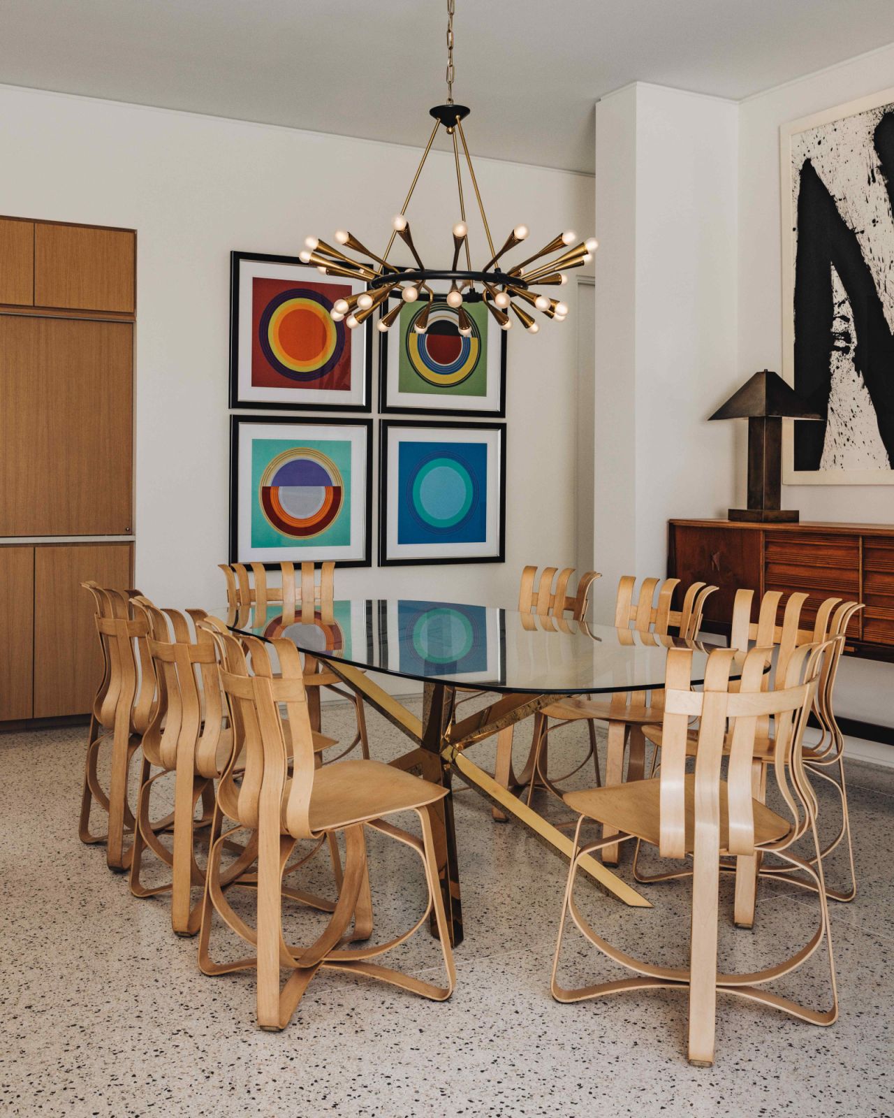 Sculptural Frank Gehry hat trick bent maple dining chairs