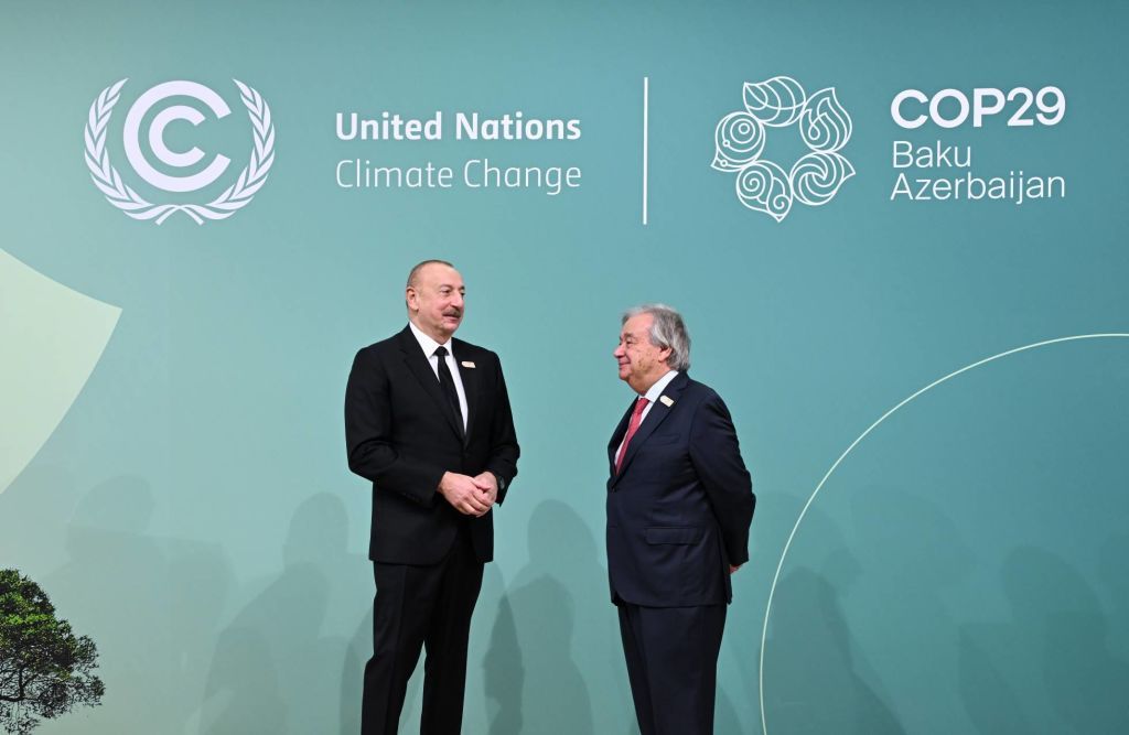 BAKU, AZERBAIJAN - NOVEMBER 12: (----EDITORIAL USE ONLY - MANDATORY CREDIT -'PRESIDENCY OF AZERBAIJAN / HANDOUT' - NO MARKETING NO ADVERTISING CAMPAIGNS - DISTRIBUTED AS A SERVICE TO CLIENTS----) Azerbaijani President Ilham Aliyev (L) and Secretary-General of the United Nations Antonio Guterres (R) arrive to attend the 29th UN Climate Change Conference (COP29)'s World Leaders Climate Action Summit in Baku, Azerbaijan on November 12, 2024. (Photo by Presidency of Azerbaijan Handout/Anadolu via Getty Images)