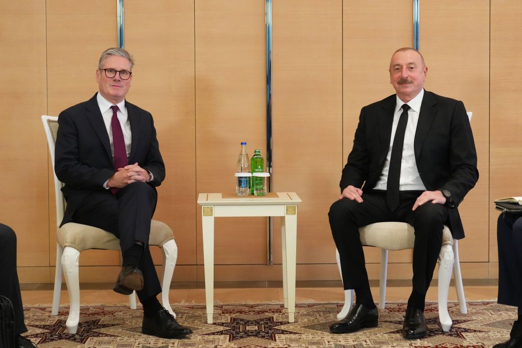 BAKU, AZERBAIJAN - NOVEMBER 12: British Prime Minister Keir Starmer and Azerbaijan president Ilham Aliyev pose during a bilateral meeting on day two of the COP29 climate conference on November 12, 2024 in Baku, Azerbaijan. The UK government is expected to unveil new plans to further cut greenhouse gas emissions, during the COP29 summit. (Photo by Carl Court/Getty Images)