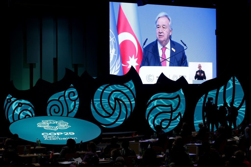 BAKU, AZERBAIJAN - NOVEMBER 12: UN Secretary General Antonio Guterres is displayed on a screen as he delivers a speech during the opening ceremony of the World Leaders Climate Action Summit on day two of the UNFCCC COP29 Climate Conference at Baku Stadium on November 12, 2024 in Baku, Azerbaijan. The COP29, which is running from November 11 through 22, is bringing together stakeholders, including international heads of state and other leaders, scientists, environmentalists, indigenous peoples representative