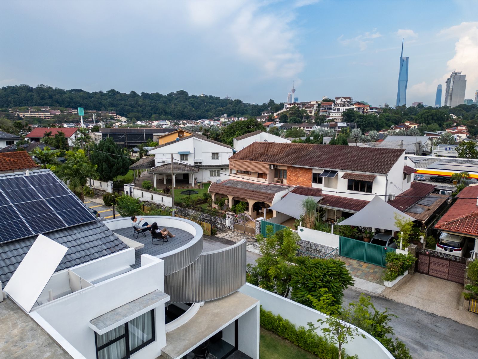 Solar panels and landscaped gardens integrate sustainability with modern design