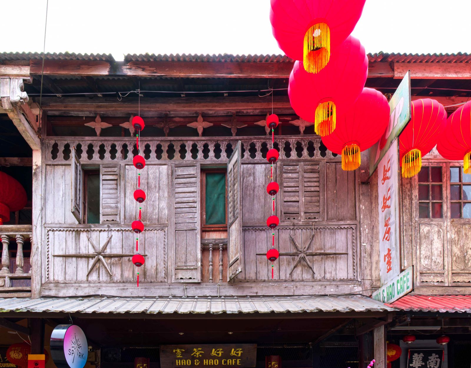 The shophouses constructed of unadorned wood panels