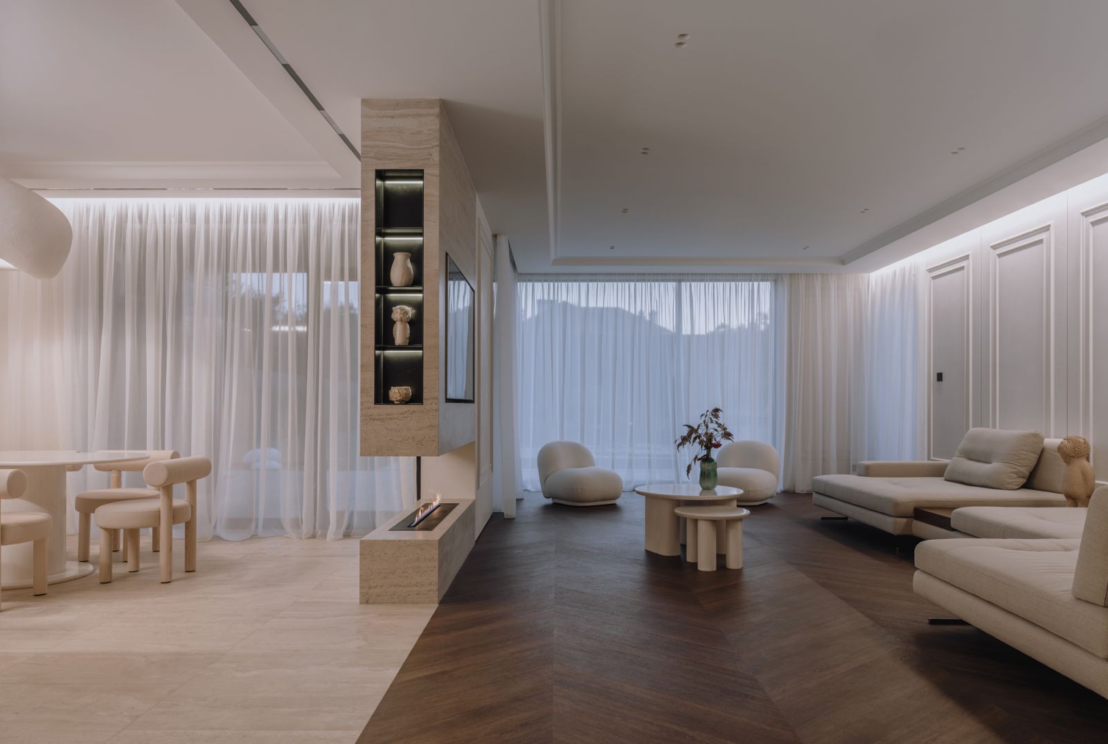 The dining and living areas are demarcated by different floor finishes